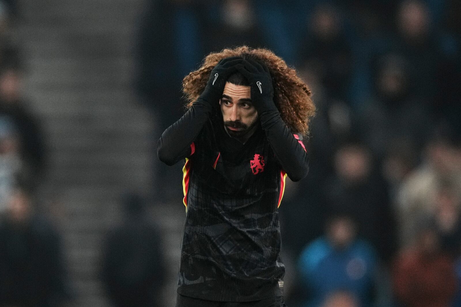 Chelsea's Marc Cucurella reacts during the English Premier League soccer match between Brighton and Chelsea in Brighton, England, Friday, Feb. 14, 2025. (AP Photo/Dave Shopland)