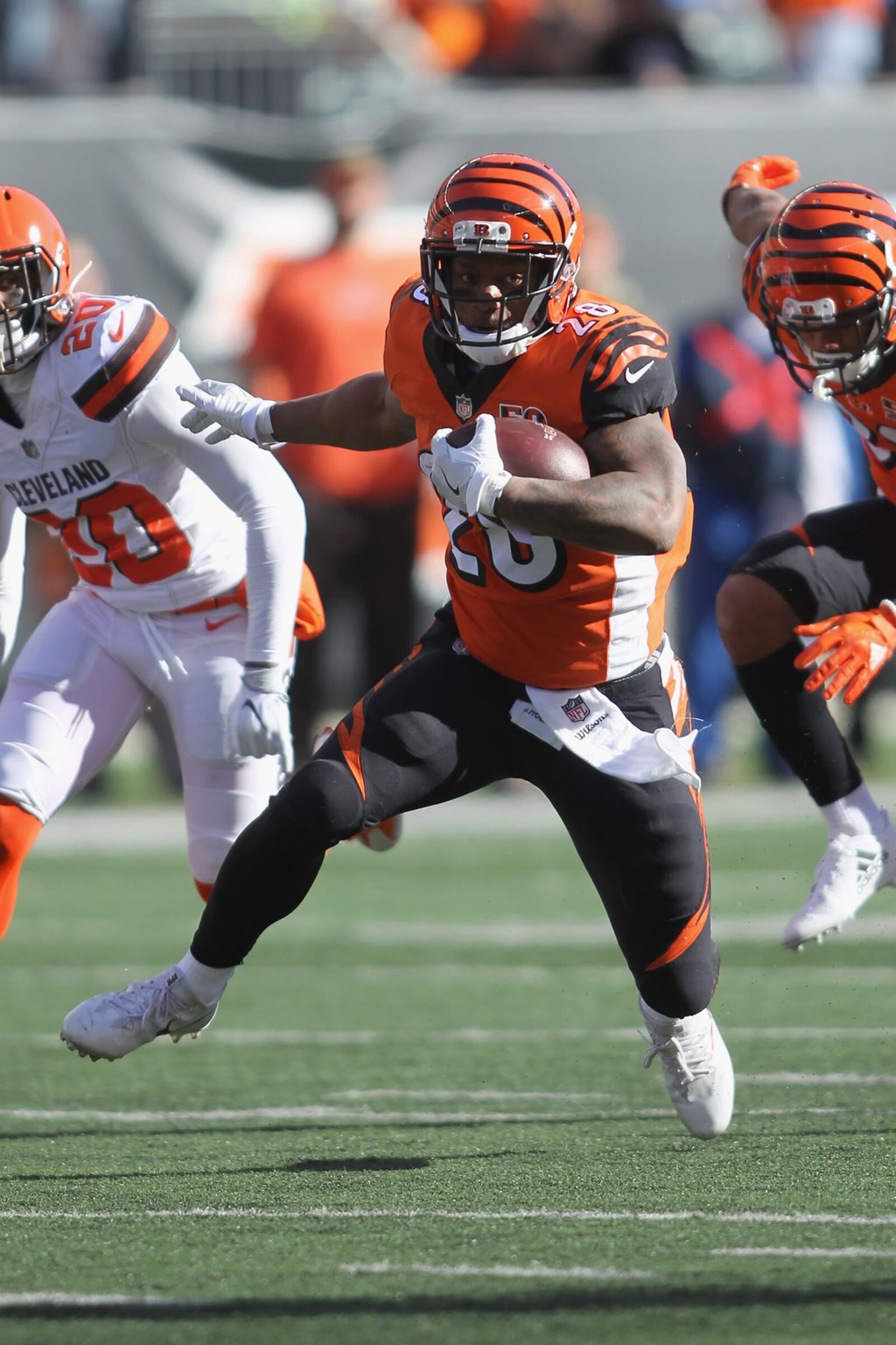 CINCINNATI, OH - NOVEMBER 26: Joe Mixon #28 of the Cincinnati Bengals runs the football upfield against Briean Boddy-Calhoun #28 of the Cleveland Browns during their game at Paul Brown Stadium on November 26, 2017 in Cincinnati, Ohio. The Bengals defeated the Browns 30-16. (Photo by John Grieshop/Getty Images)