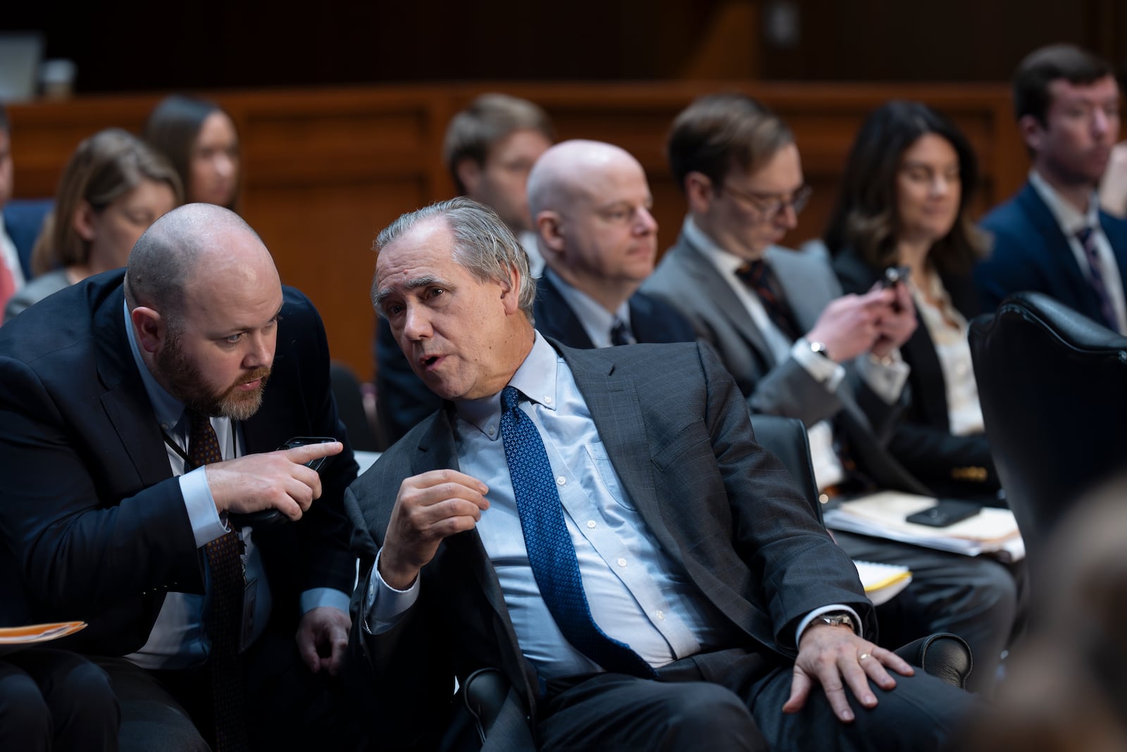 Sen. Jeff Merkley, D-Ore., the ranking member of the Senate Budget Committee, confers with staff as the panel works on the markup of the Fiscal Year 2025 Budget Resolution, at the Capitol in Washington, Wednesday, Feb. 12, 2025. Senate Republicans are vowing to move quickly on a budget plan that could pave the way for billions more in additional border security and defense spending. (AP Photo/J. Scott Applewhite)