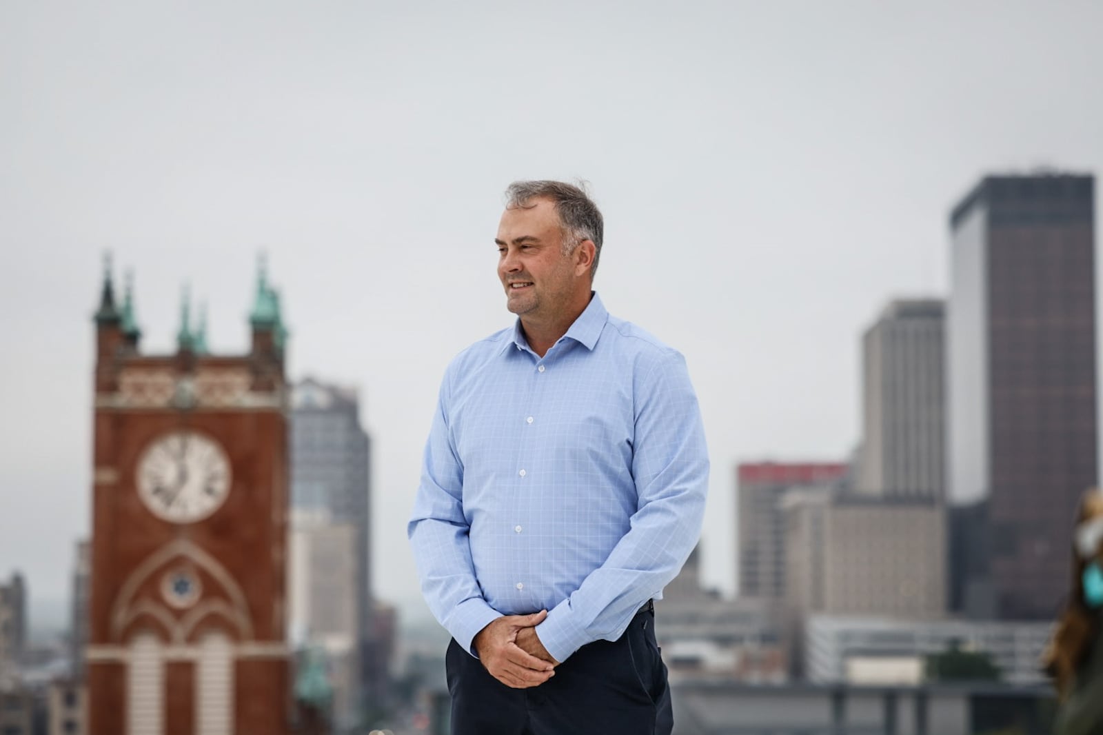 Jason Woodard, from Dayton is the founder and principal of Dayton-based Woodard Development. Woodard is photographed on the Manhattan building in Dayton, a building his company bought and rehabbed. JIM NOELKER/STAFF