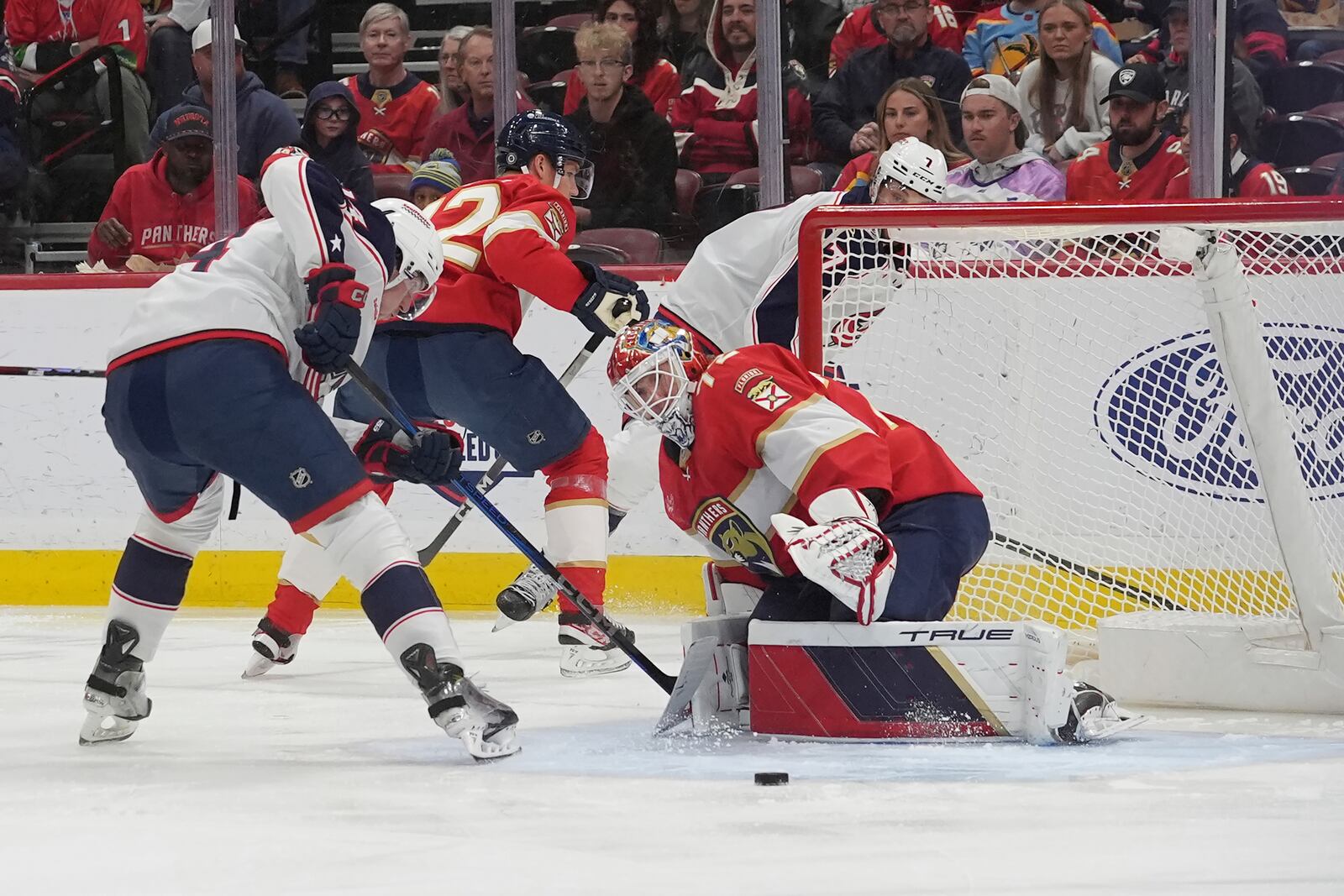 Florida Panthers goaltender Sergei Bobrovsky (72) deflects a shot on goal by Columbus Blue Jackets center Joseph LaBate during the first period of an NHL hockey game, Thursday, March 6, 2025, in Sunrise, Fla. (AP Photo/Marta Lavandier)