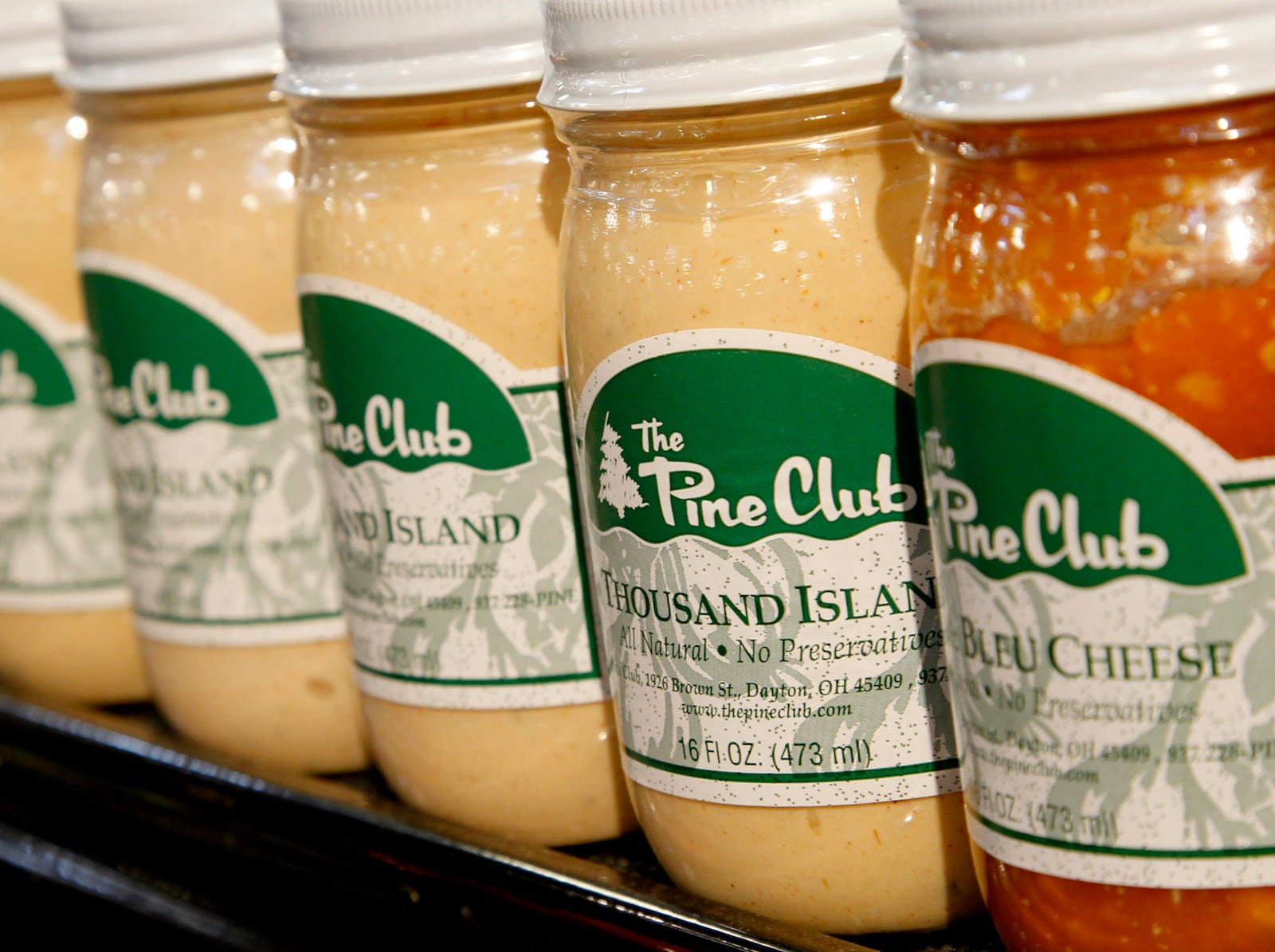 Cincinnati-based Kroger Co. is using popular regional brands, like Pine Club dressings, to attract loyal customers and boost profits. Store officials say those brands inject local flavor into stores and give local customers what they want. LISA POWELL / STAFF