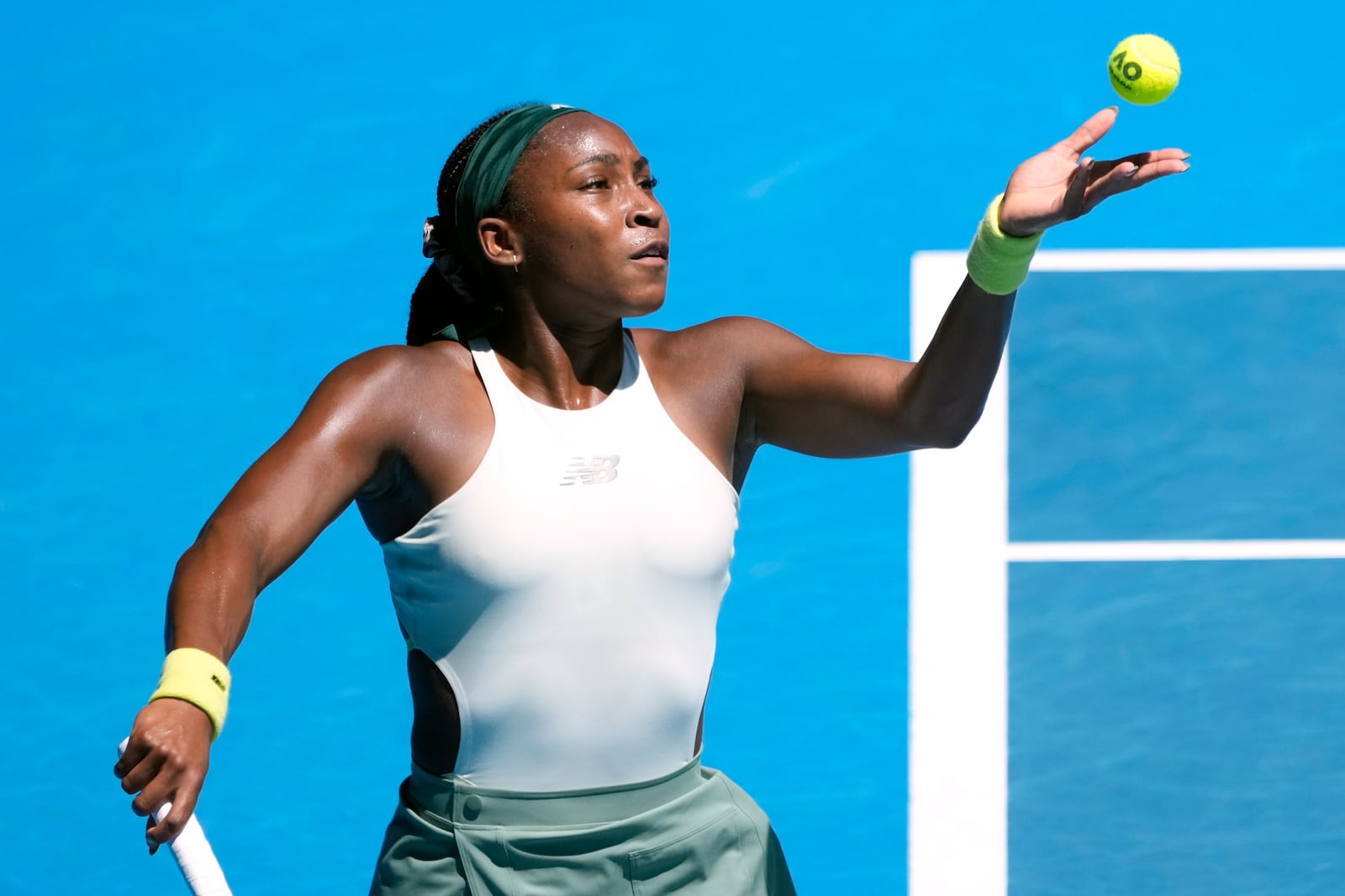 Coco Gauff of the U.S. serves to Sofia Kenin of the U.S.during their first round match at the Australian Open tennis championship in Melbourne, Australia, Monday, Jan. 13, 2025. (AP Photo/Asanka Brendon Ratnayake)