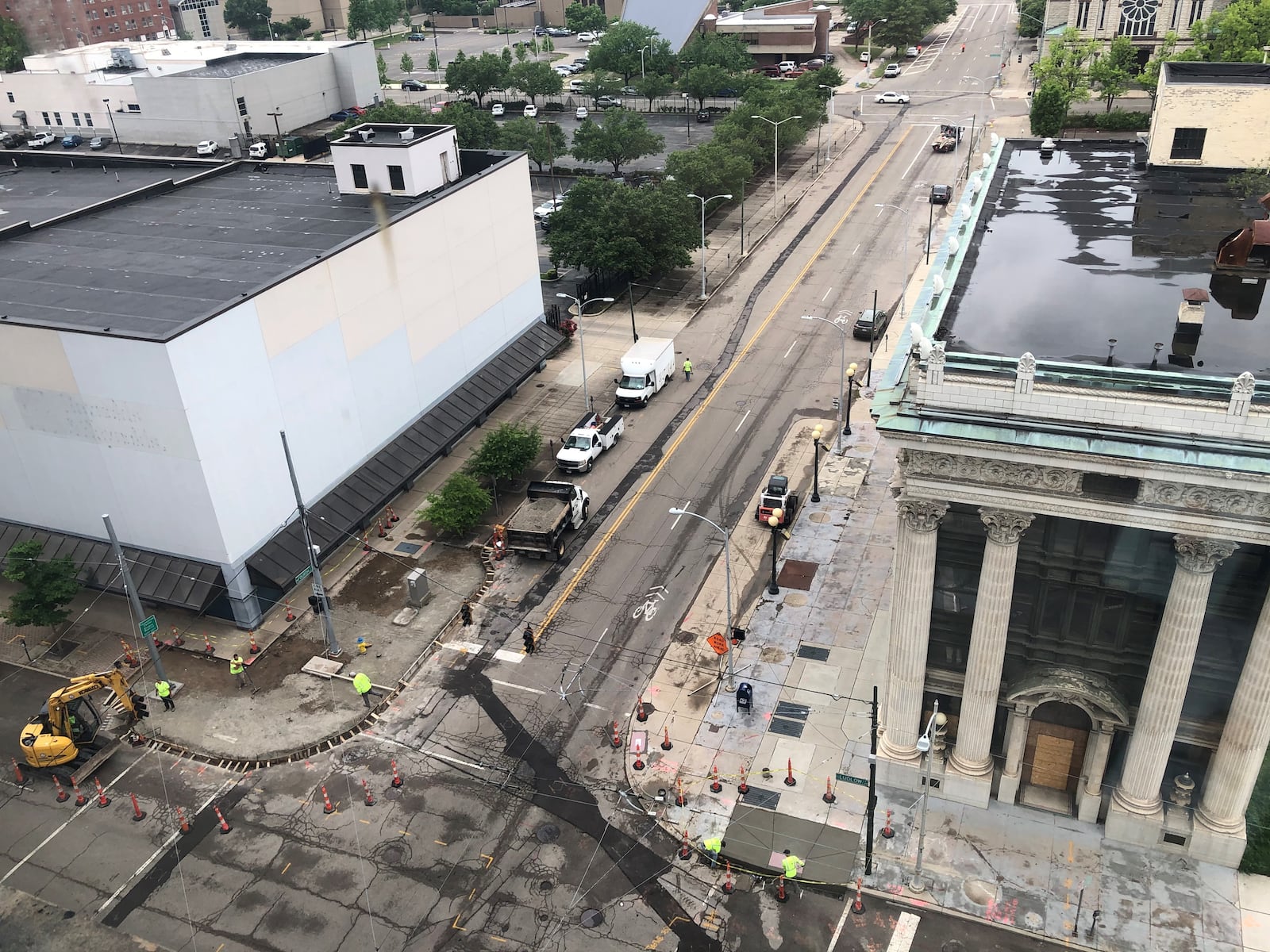 Crews work at the intersection of West Fourth and South Ludlow streets in downtown Dayton in May. CORNELIUS FROLIK / STAFF