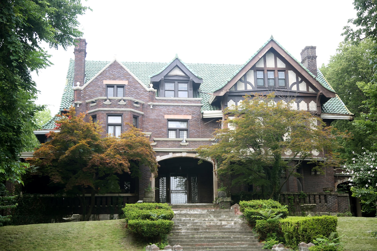 This Jacobean Tudor home in the Dayton View Historic District was built in 1910 for Leopold Rauh. 
Rauh was the president of the Egry Register Company instrumental in establishing Dayton's commission-manager form of government. 
Designed by Dayton architect Albert Pretzinger, the home has 24 rooms and 8 1/2 baths. During the housing shortage of World War II, the third-floor ballroom was converted to six bedrooms and occupied. LISA POWELL / STAFF
