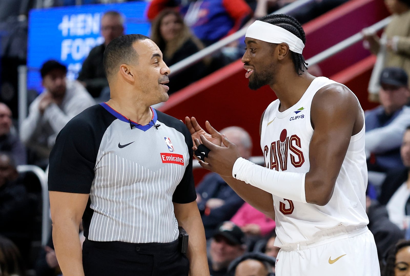 Cleveland Cavaliers guard Caris LeVert (3) makes a point while talking with referee Curtis Blair (74) during the first half of an NBA basketball game against the Detroit Pistons Wednesday, Feb. 5, 2025, in Detroit. (AP Photo/Duane Burleson)