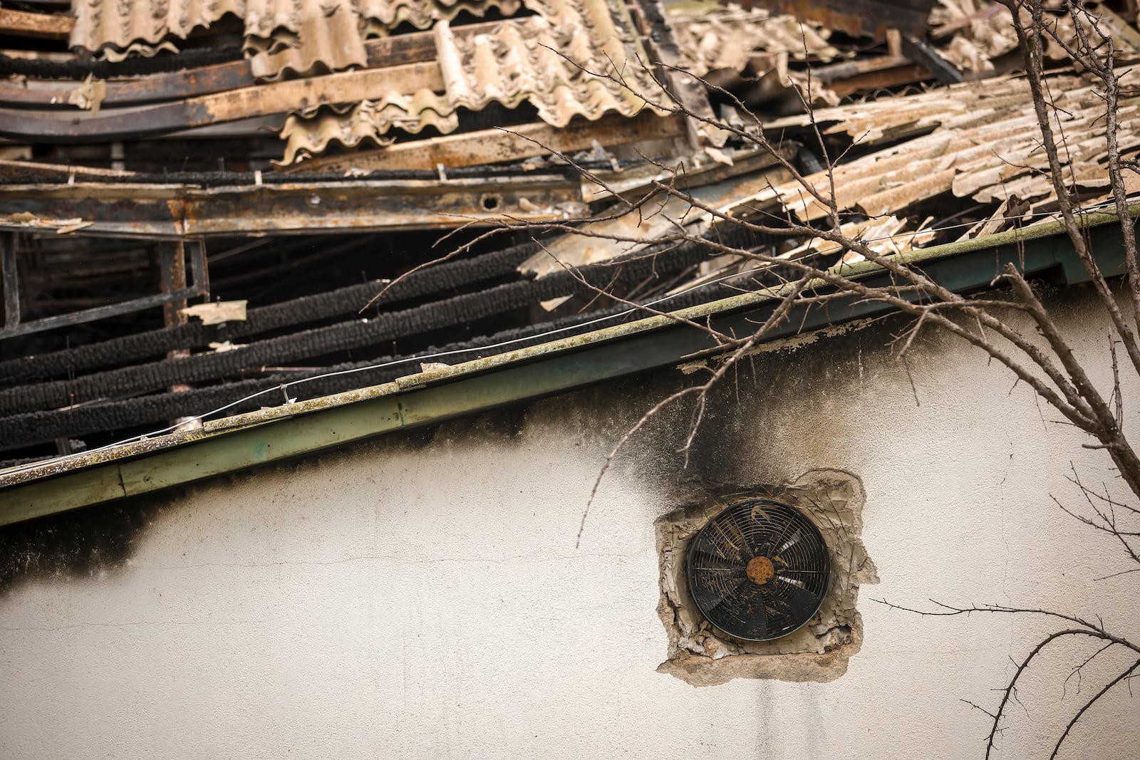 A charred ventilator on the wall of a nightclub building, damaged following a massive fire early Sunday in the town of Kocani, North Macedonia, Monday, March 17, 2025, (AP Photo/Armin Durgut)