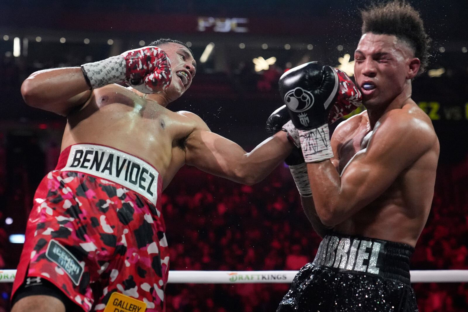 David Benavidez lands a left to David Morrell during a light heavyweight title boxing match Saturday, Feb. 1, 2025, in Las Vegas. (AP Photo/John Locher)