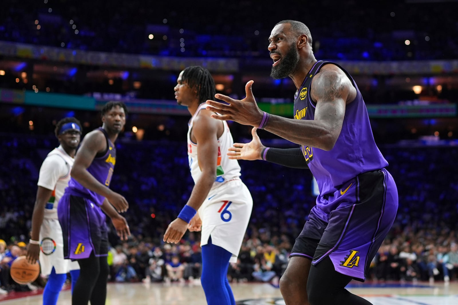 Los Angeles Lakers' LeBron James reacts after being called for a foul during the second half of an NBA basketball game against the Philadelphia 76ers, Tuesday, Jan. 28, 2025, in Philadelphia. (AP Photo/Matt Slocum)