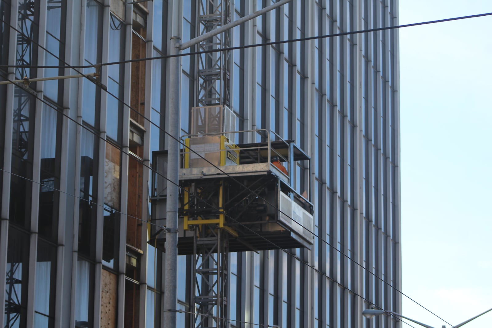 Work continues on the Grant Deneau Tower on West Fourth Street in downtown Dayton. Developer Windsor Companies plans to convert the office tower into about 150 new apartments, plus office, retail and restaurant space. CORNELIUS FROLIK / STAFF