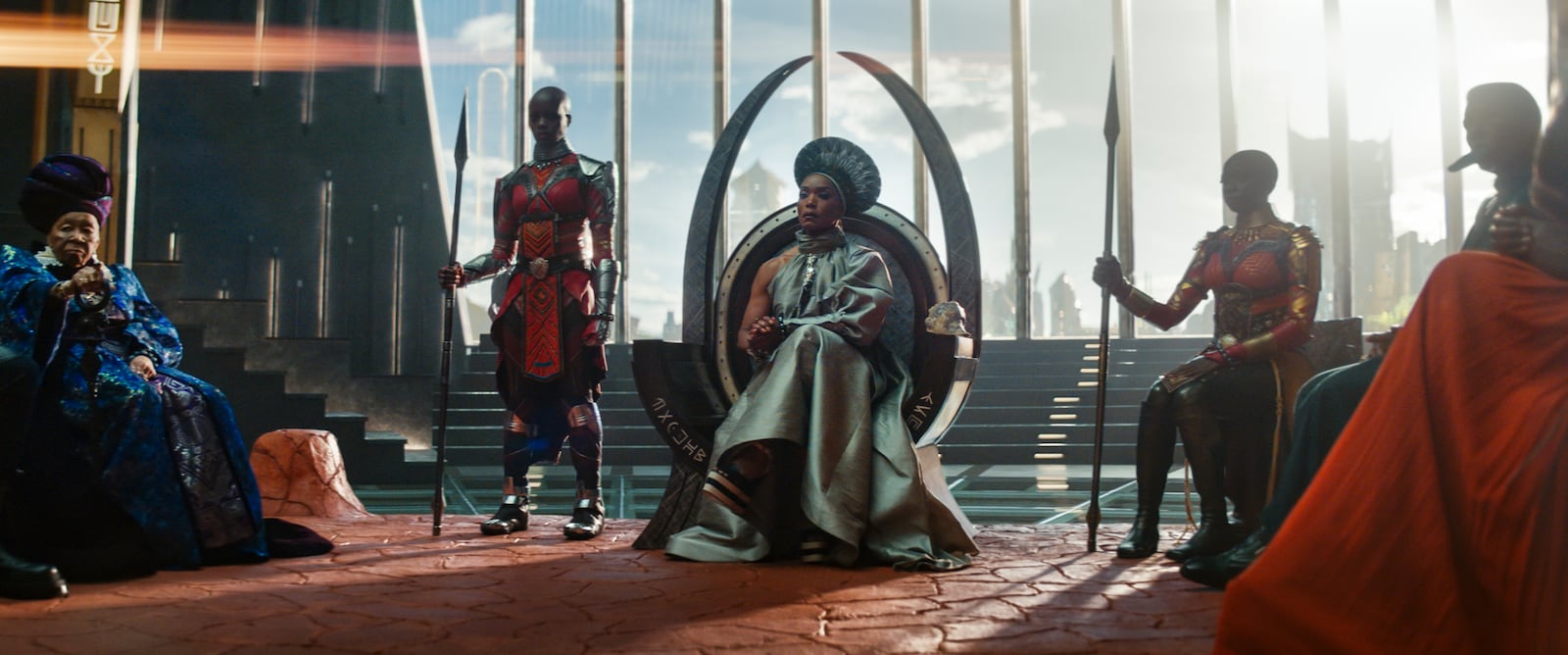 This image released by Marvel Studios shows, from left,  Dorothy Steel as Merchant Tribe Elder, Florence Kasumba as Ayo, Angela Bassett as Ramonda, and Danai Gurira as Okoye in a scene from "Black Panther: Wakanda Forever." (Marvel Studios via AP)