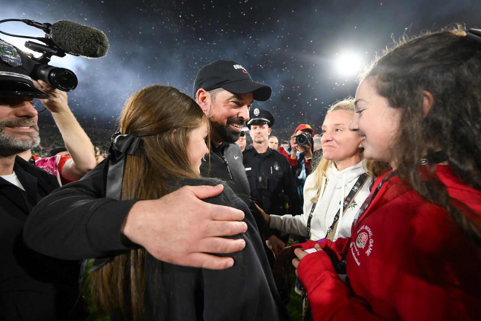 Ohio State head coach Ryan Day, center, celebrates with his family after winning the quarterfinals of the Rose Bowl College Football Playoff against Oregon, Wednesday, Jan. 1, 2025, in Pasadena, Calif. (AP Photo/Kyusung Gong)