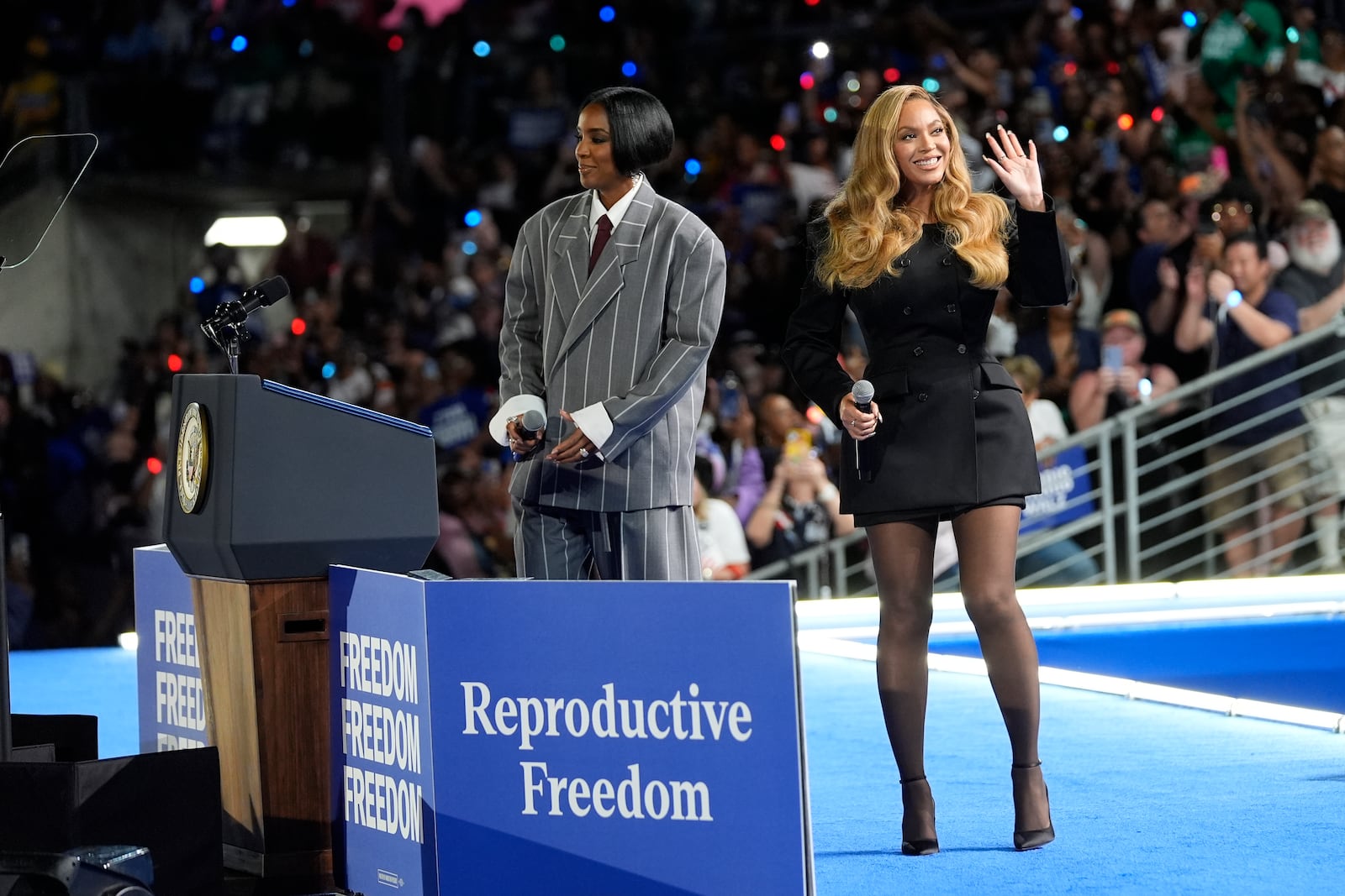 Musical artists Beyonce, right, and Kelly Rowland, left, on stage at a campaign event for Democratic presidential nominee Vice President Kamala Harris in Houston, Friday, Oct. 25, 2024. (AP Photo/Susan Walsh)