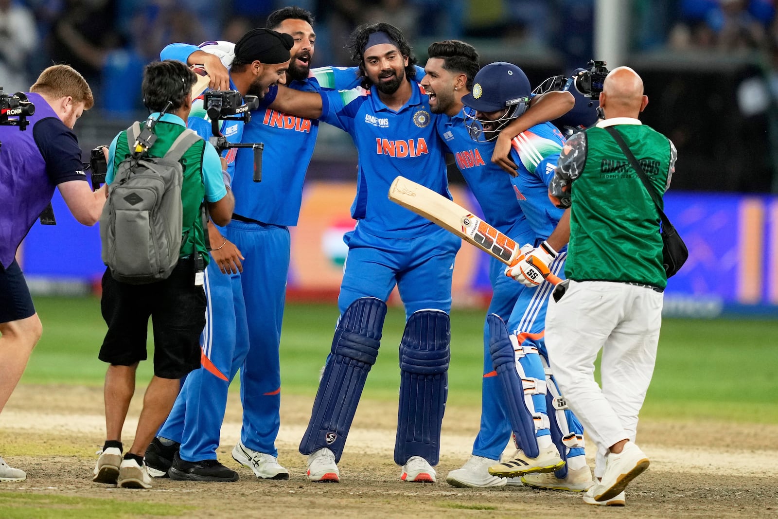 India's players celebrate after winning the ICC Champions Trophy final cricket match against New Zealand at Dubai International Cricket Stadium in Dubai, United Arab Emirates, Sunday, March 9, 2025. (AP Photo/Altaf Qadri)