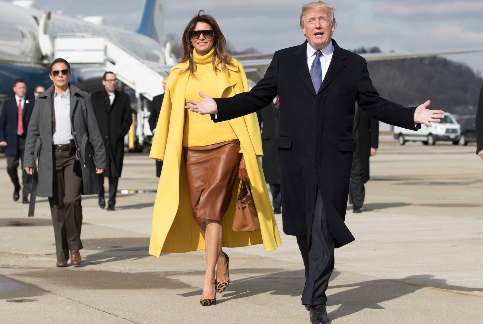 President Donald Trump and first lady Melania Trump arrive at Cincinnati Municipal Lunken Airport in Ohio, Feb. 5, 2018. The president is scheduled to speak about tax reform during a tour at the Sheffer Corporation in Ohio Monday, while the first lady will make a visit to the Cincinnati Children?s Hospital. (Tom Brenner/The New York Times)