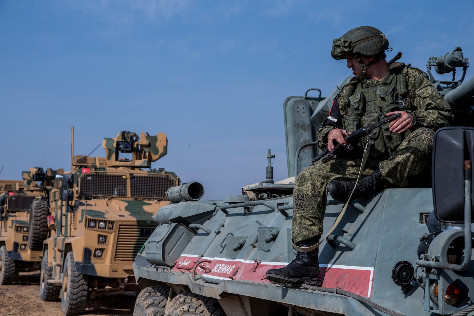 FILE - Turkish and Russian patrol is seen near the town of Darbasiyah, Syria, Friday, Nov. 1, 2019. (AP Photo/Baderkhan Ahmad, File)