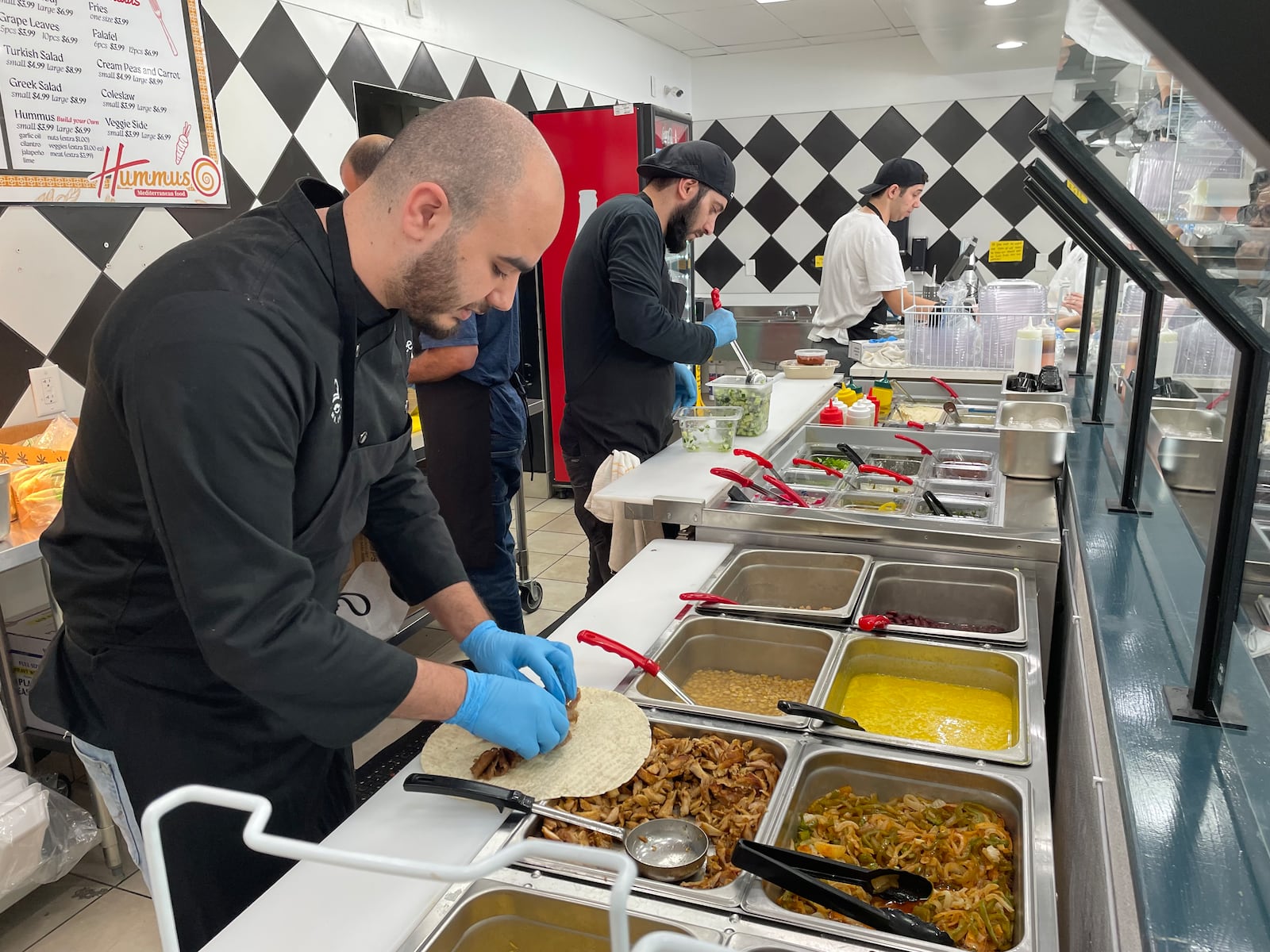 Hummus Mediterranean Food is located at 75 N. Main St. in Springboro. Pictured is Owner Hamzeh Odeh. NATALIE JONES/STAFF