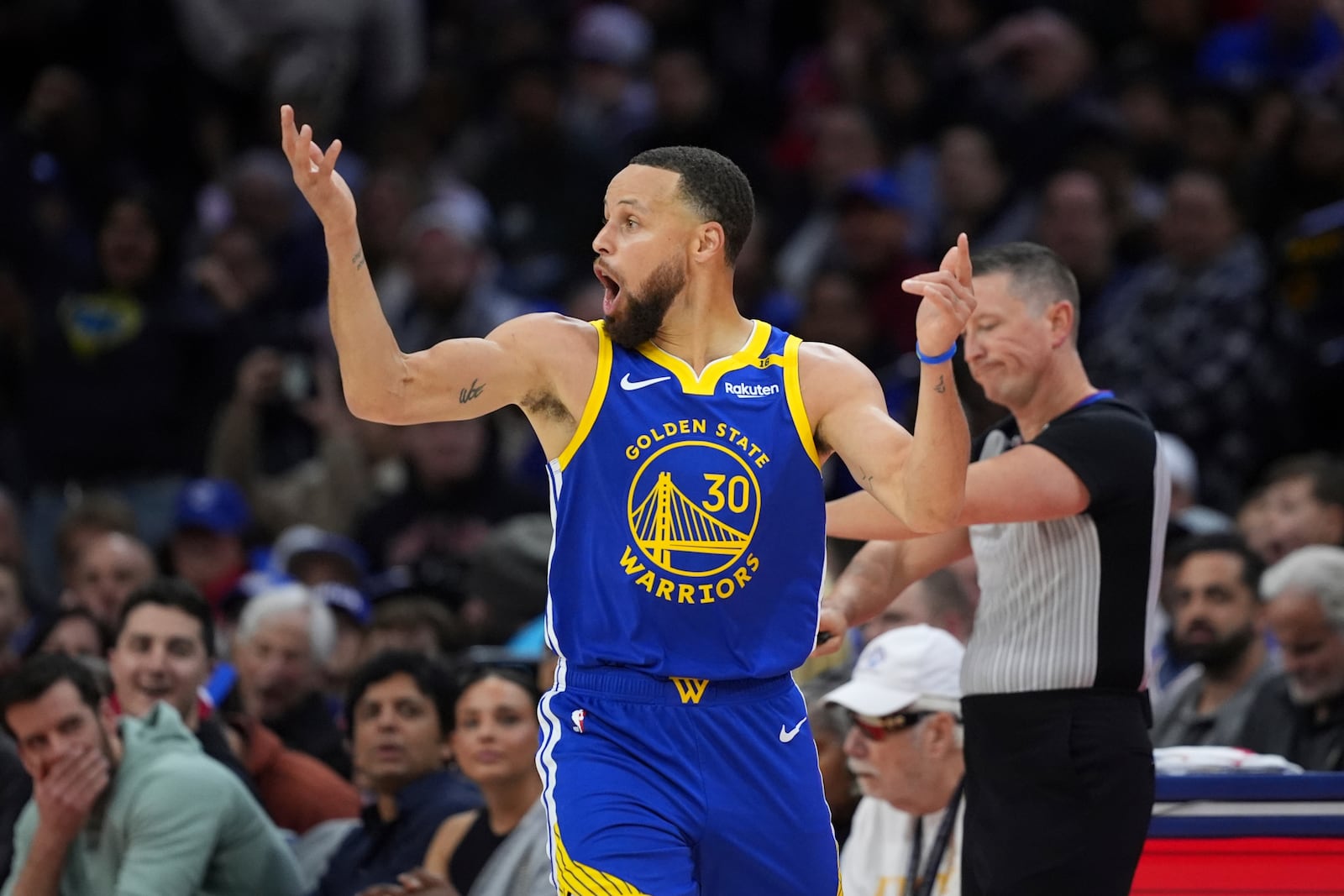 Golden State Warriors' Stephen Curry reacts after being fouled during the first half of an NBA basketball game against the Philadelphia 76ers Saturday, March 1, 2025, in Philadelphia. (AP Photo/Matt Slocum)