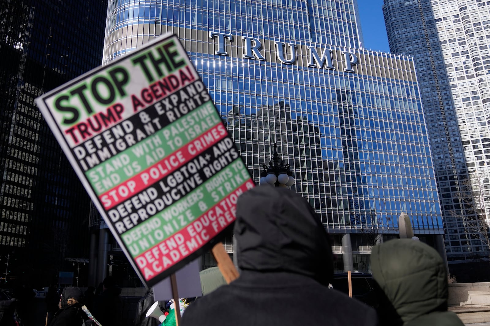 Anti-Trump protesters march to Trump Tower as they rally for a number of issues, including immigrant rights, the Israel-Hamas war, women's reproductive rights, racial equality and others, on the day of President Trump's Inauguration, Monday, Jan. 20, 2025, in Chicago. (AP Photo/Erin Hooley)