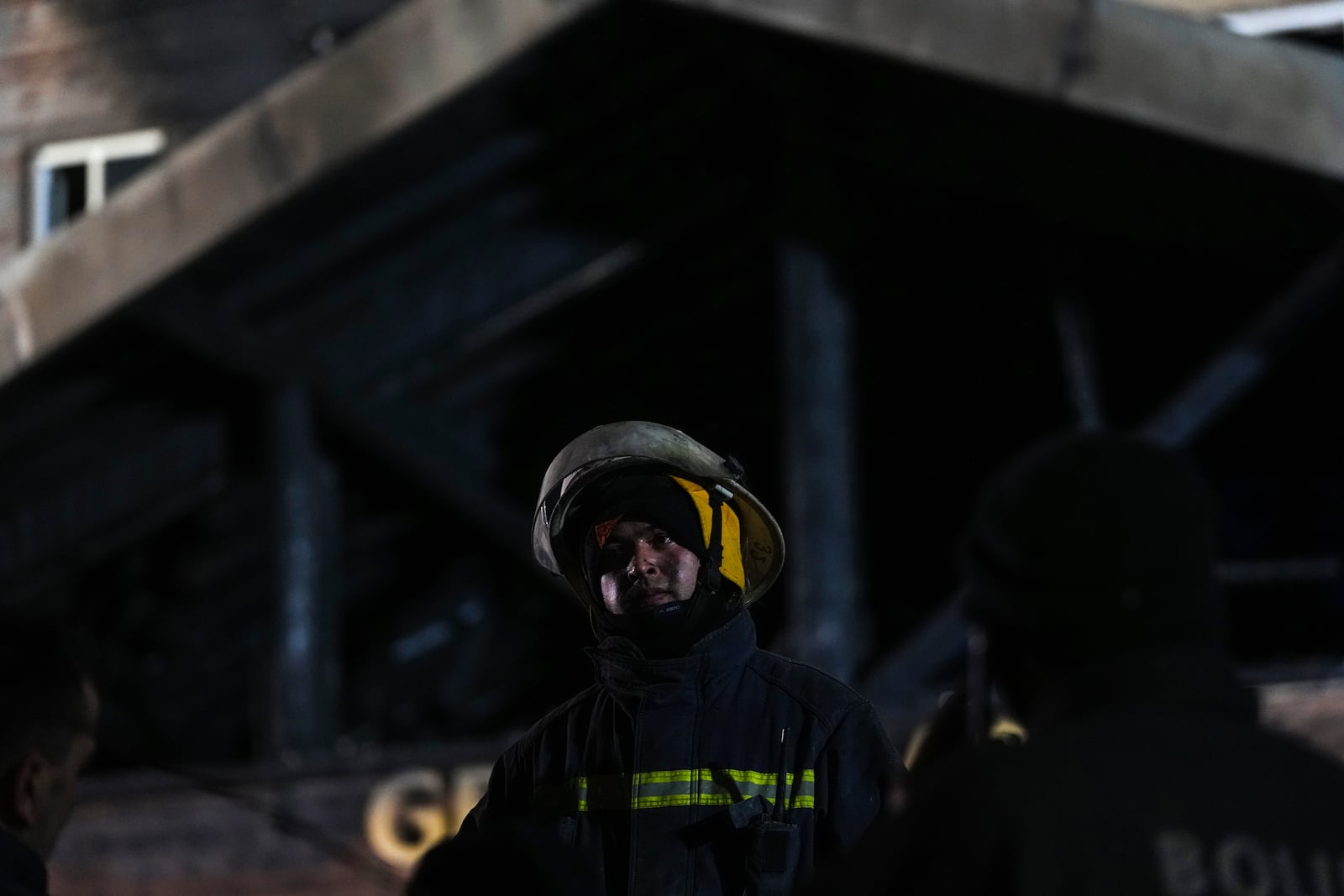 Firefighters and emergency teams work after a fire that broke out at a hotel in the ski resort of Kartalkaya, located in Bolu province, northwest Turkey, on Tuesday, Jan. 21, 2025. (AP Photo/Francisco Seco)