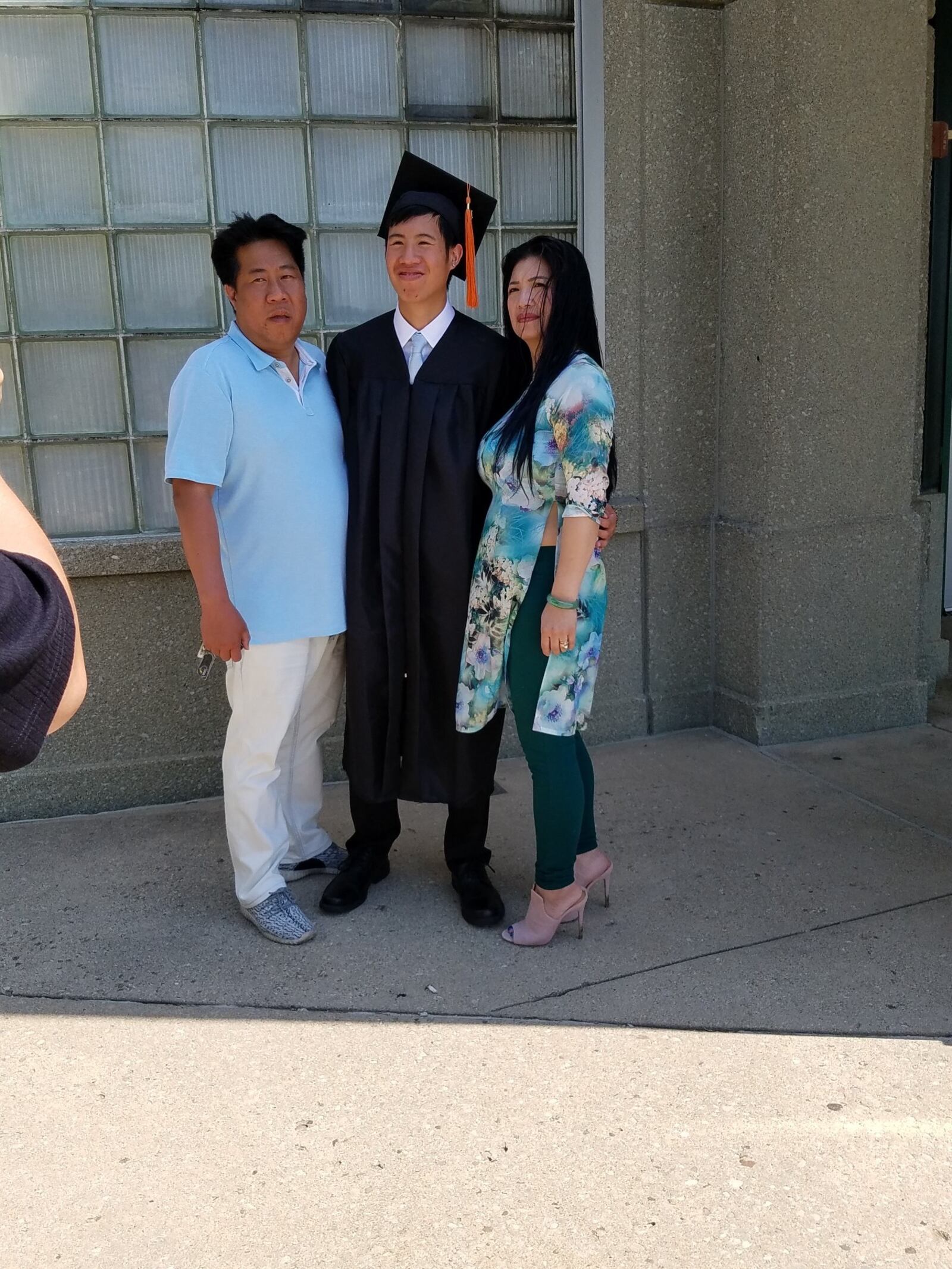 Tommy Nguyen with his parents, Lily and Tommy Sr., at his Beavercreek High graduation. CONTRIBUTED