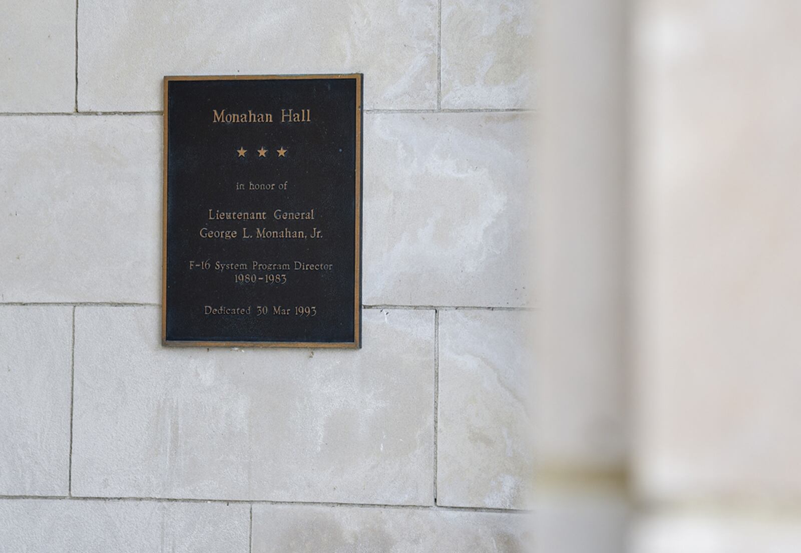 A plaque next to the entrance of Bldg. 12 on Area B on Wright-Patterson Air Force Base honors Lt. Gen. George Monahan Jr. U.S. AIR FORCE PHOTO/MATTHEW CLOUSE