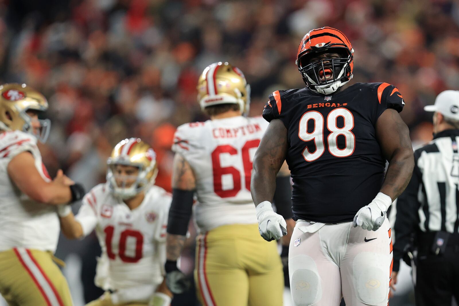 Cincinnati Bengals' D.J. Reader (98) celebrates a sack of San Francisco 49ers quarterback Jimmy Garoppolo (10) during the second half of an NFL football game, Sunday, Dec. 12, 2021, in Cincinnati. (AP Photo/Aaron Doster)