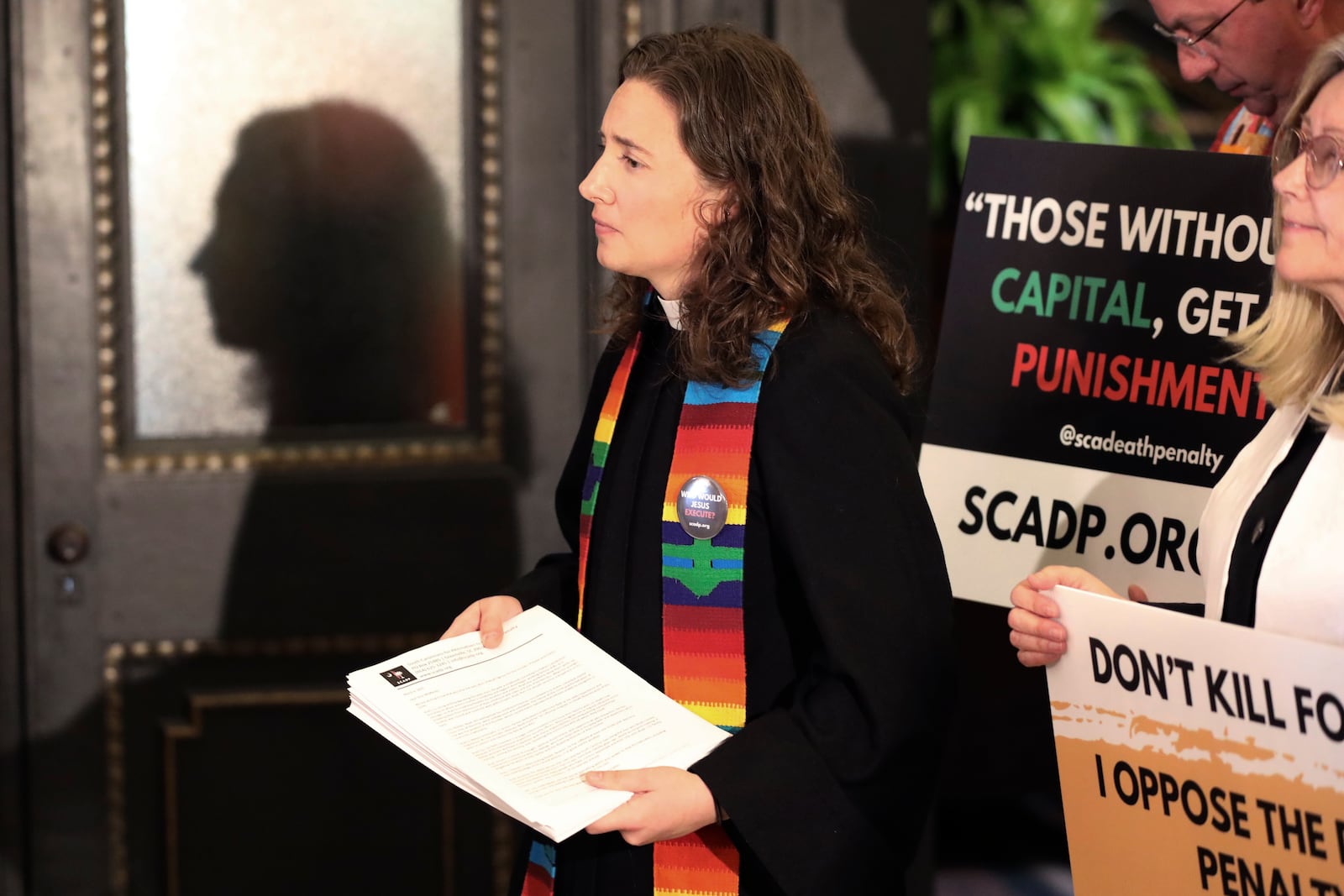 Rev. Hillary Taylor of South Carolinians for Alternatives to the Death Penalty prepares to present a petition to stop the firing squad execution of Brad Sigmon to the South Carolina governor's office on Thursday, March 6, 2025, in Columbia, S.C. (AP Photo/Jeffrey Collins)