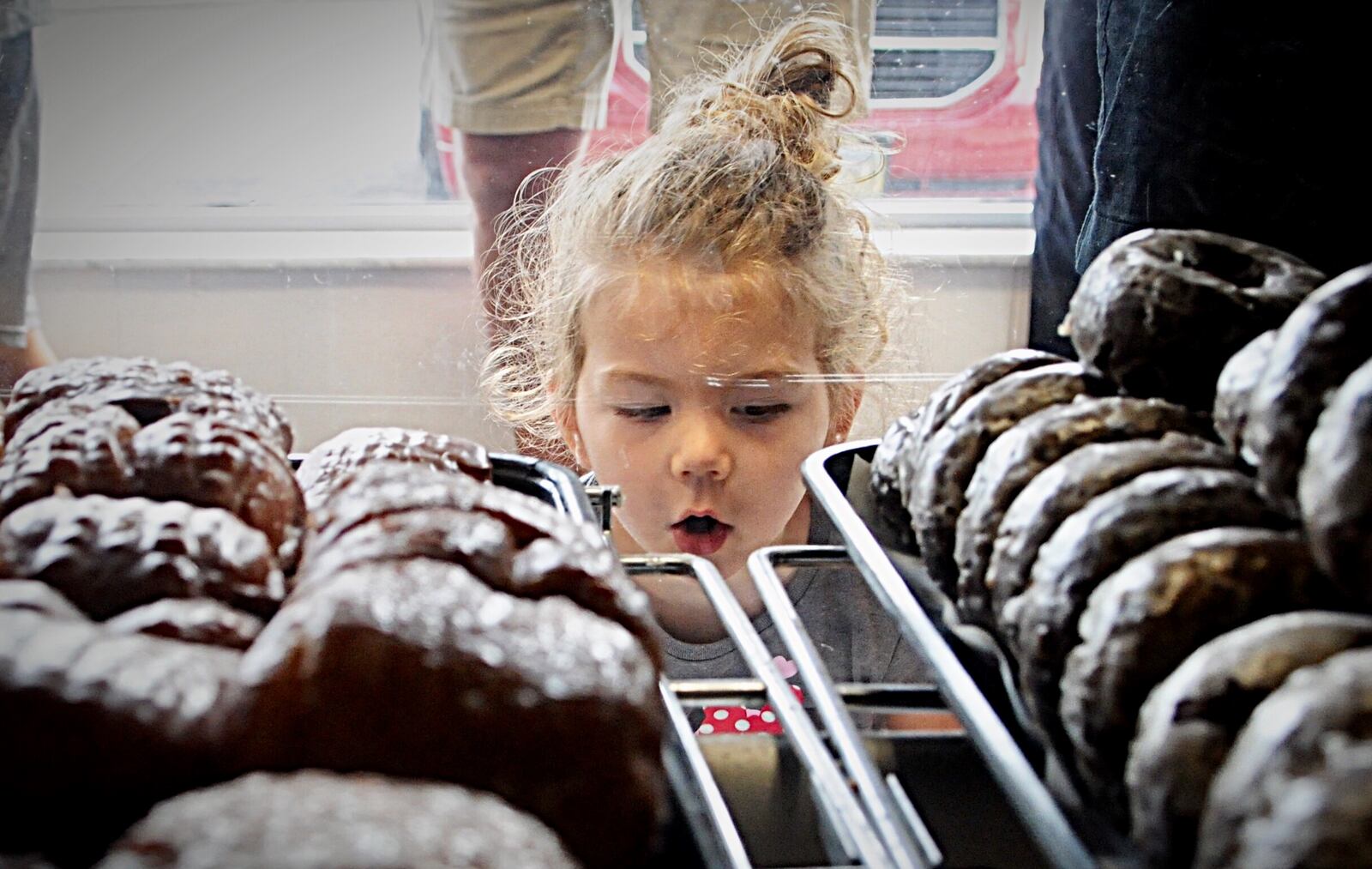 3-year-old Amelia Cordonnier checks out the donut case at Stan the Donut Man in Dayton on Friday, which was National Donut Day.