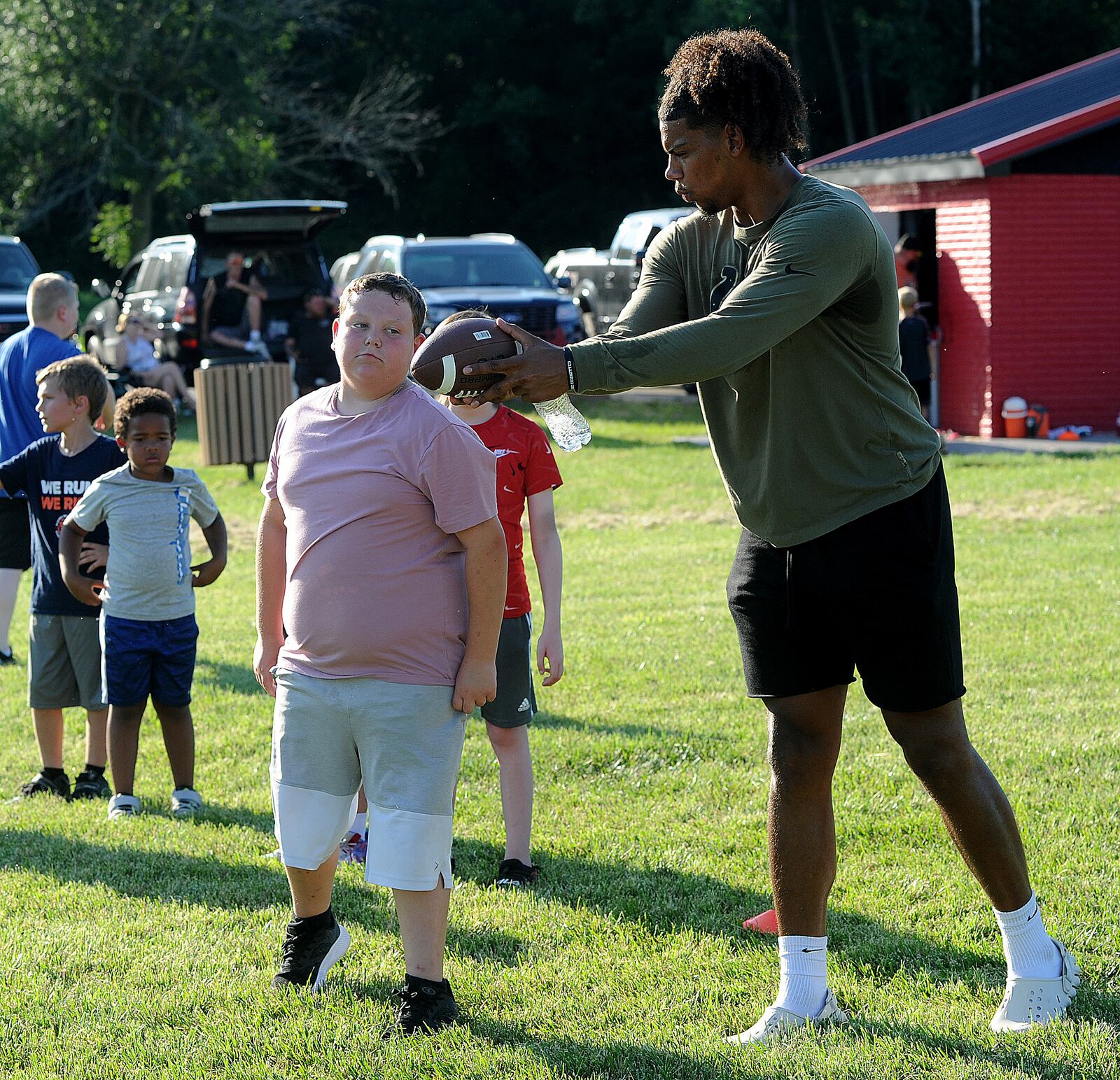 Andrew Ogletree tight end for the Indianapolis Colts and Northridge High School grad enjoys giving back to the community. Ogletree stopped by the Park Layne Wee Arrows practice near New Carlisle on Thursday, July 13, 2023, to sign autographs and work out with the players. MARSHALL GORBY\STAFF