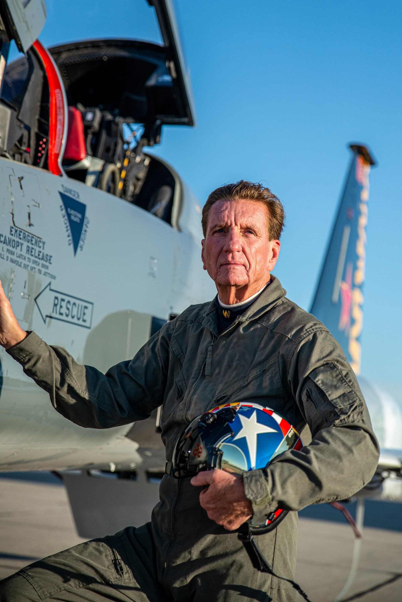 Larry Connor alongside F-5 fighter jet he has flown. CONTRIBUTED