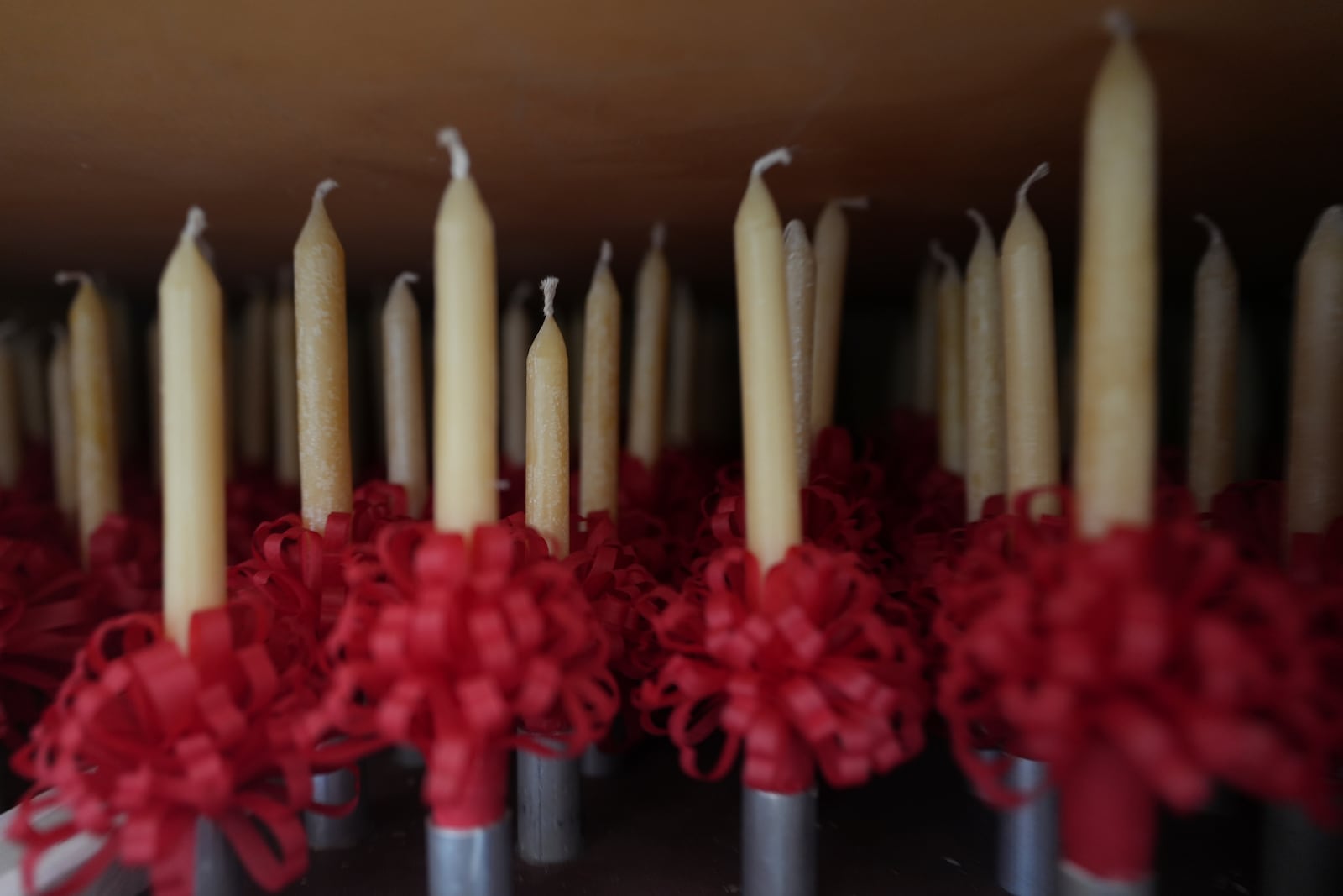 Handmade beeswax candles made by members of Central Moravian church are stored in a closet in Bethlehem, Pa., on Sunday, Dec. 1, 2024, in preparation to be lit during Christmas services. (AP Photo/Luis Andres Henao)