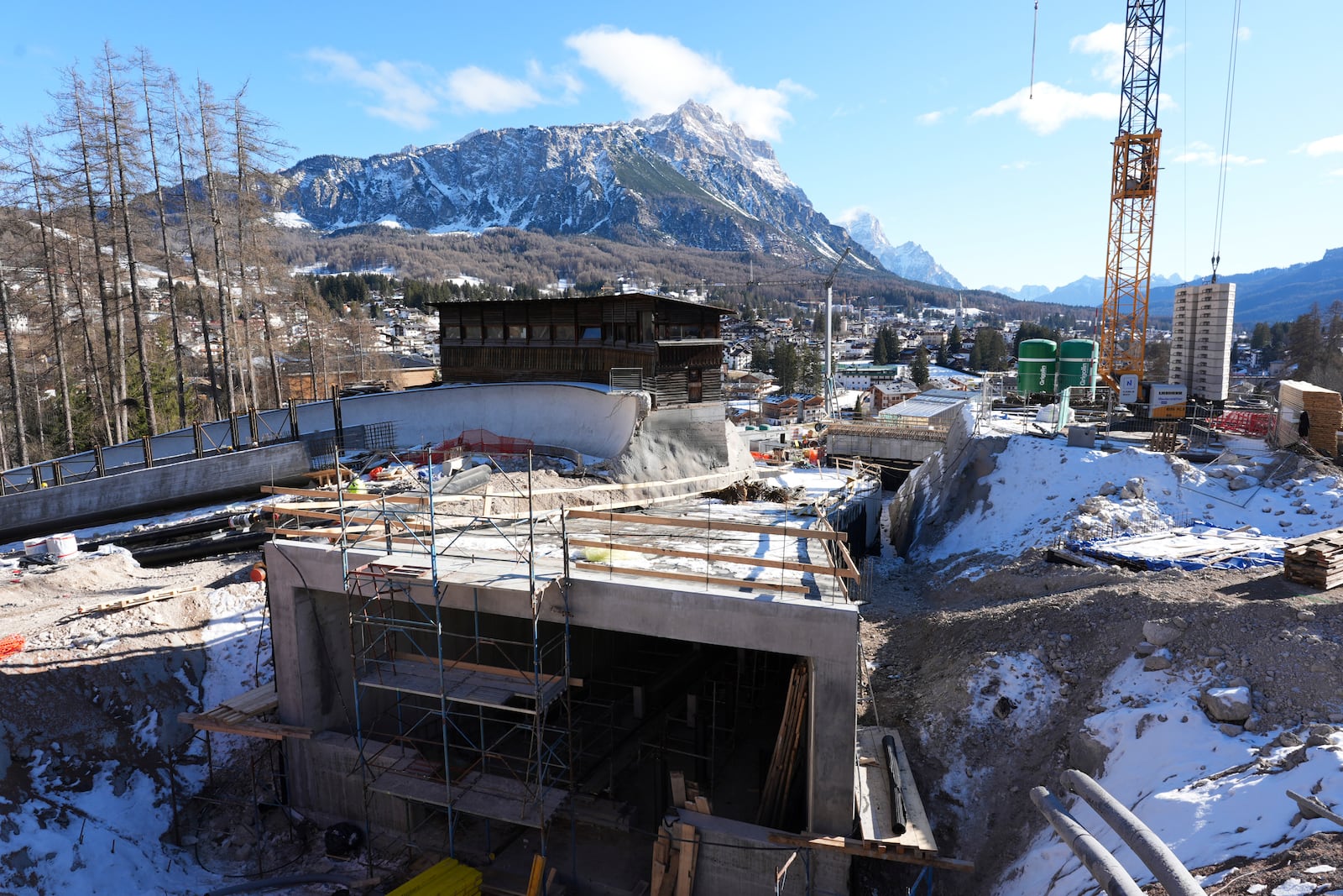 Construction work takes place at the Cortina Sliding Center, venue for the bob, luge and skeleton disciplines, at the Milan Cortina 2026 Winter Olympics, in Cortina d'Ampezzo, Italy, Thursday, Jan. 16, 2025. (AP Photo/Giovanni Auletta)