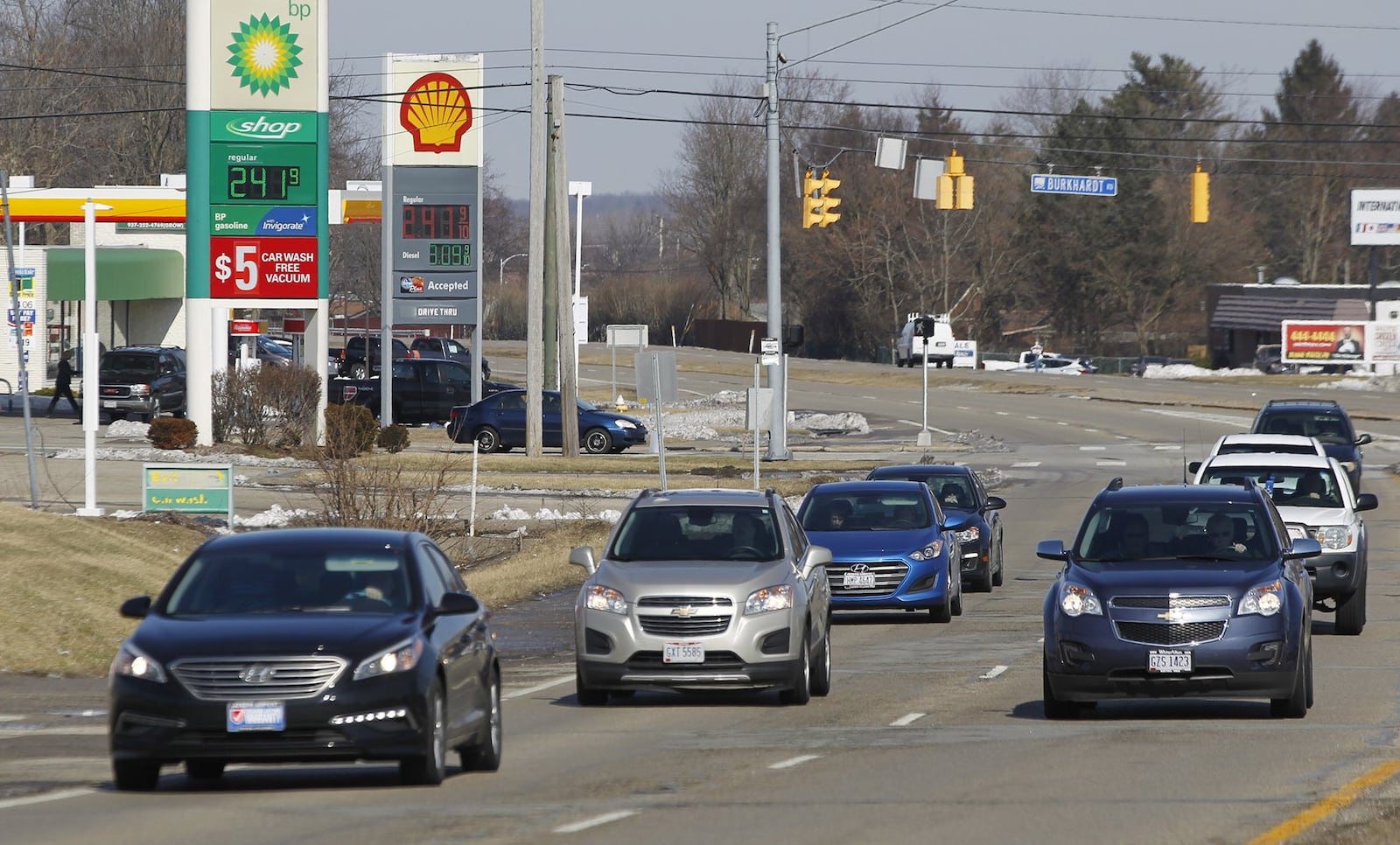 Woodman Drive at Burkhardt Road where three gas stations exist. Gov. Mike DeWine says he will ask lawmakers to approve an 18-cent per gallon increase in the state’s gasoline tax, which currently stands at 28-cents. TY GREENLEES / STAFF