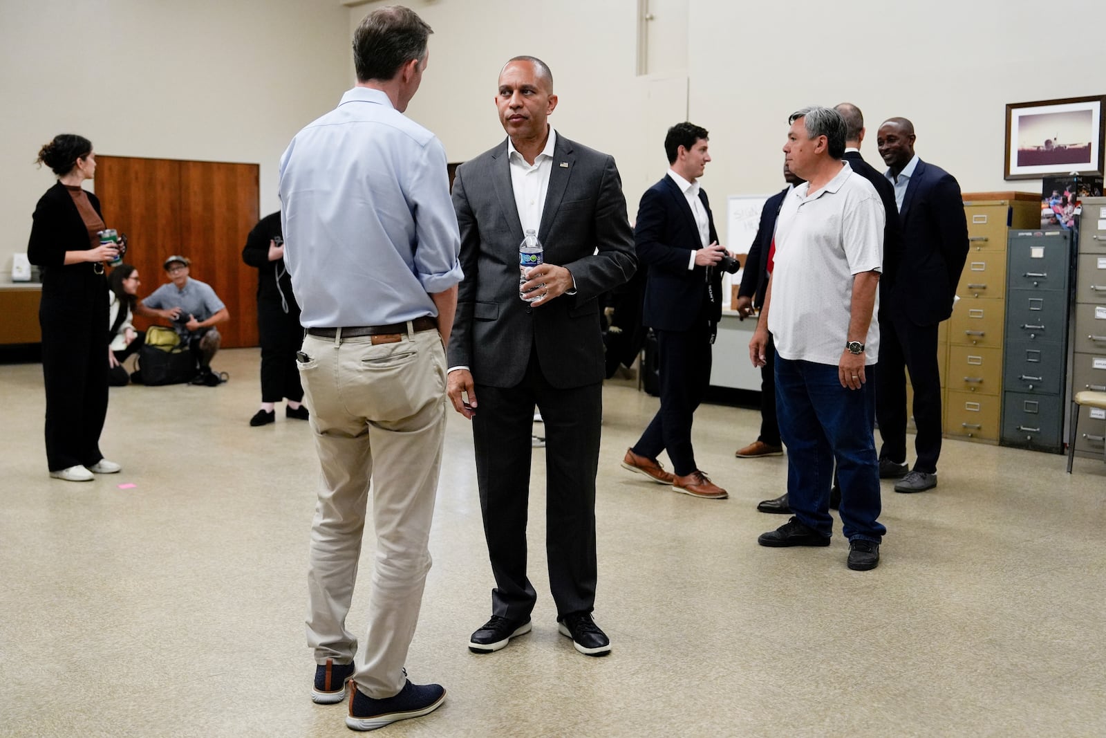 House Minority Leader Hakeem Jeffries, D-N.Y., speaks with George Whitesides before a canvass launch campaign event, Sunday, Oct. 13, 2024, in Palmdale, Calif. (AP Photo/Julia Demaree Nikhinson)