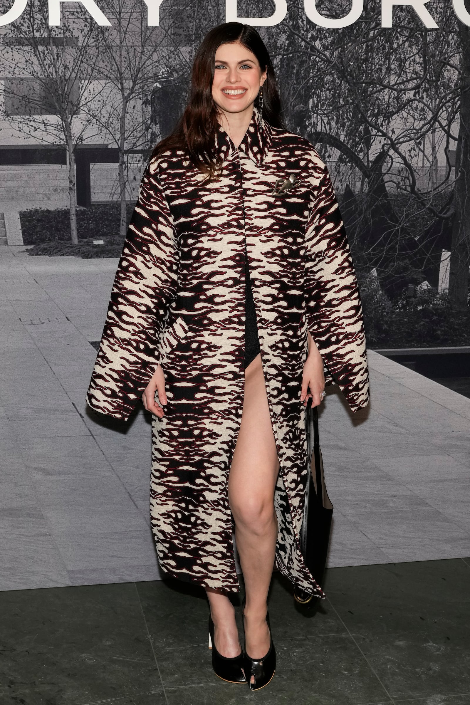 Alexandra Daddario arrives at the Tory Burch Fall/Winter 2025 fashion show as part of New York Fashion Week on Monday, Feb. 10, 2025, at the Museum of Modern Art in New York. (Photo by Charles Sykes/Invision/AP)