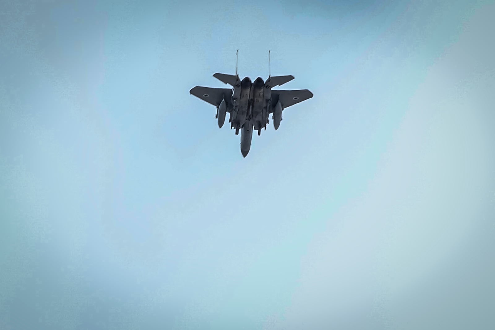 An Israeli fighter jet flies over the city during the funeral procession of Lebanon's former Hezbollah leaders, Hassan Nasrallah and his cousin and successor, Hashem Safieddine, in Beirut, Lebanon, Sunday, Feb. 23, 2025. ((AP Photo/Hussein Malla)