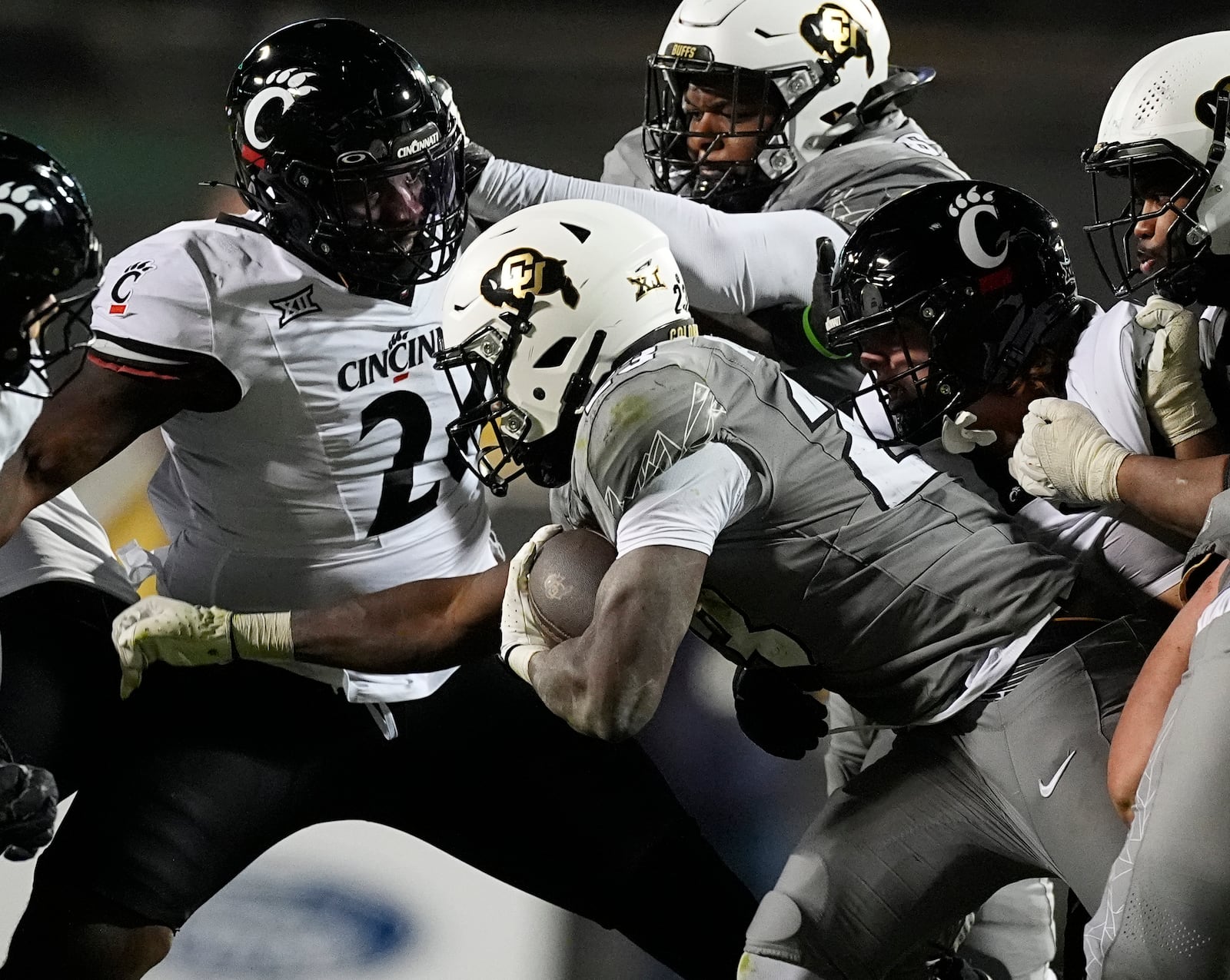 Colorado running back Isaiah Augustave, right, is stopped by Cincinnati defensive lineman Cam Roetherford in the second half of an NCAA college football game Saturday, Oct. 26, 2024, in Boulder, Colo. AP Photo/David Zalubowski)