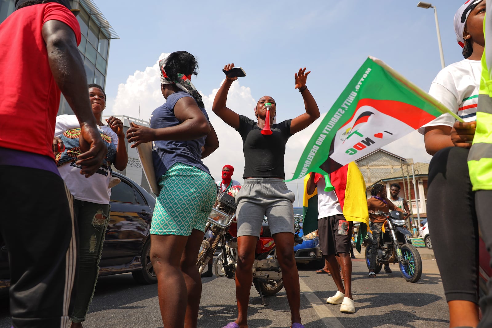 Supporters of opposition candidate and former President John Dramani Mahama celebrate their victory after Ghana's vice president and ruling party candidate, Mahamudu Bawumia conceded his defeat in Accra, Ghana, Sunday, Dec. 8, 2024. (AP Photo/Misper Apawu)