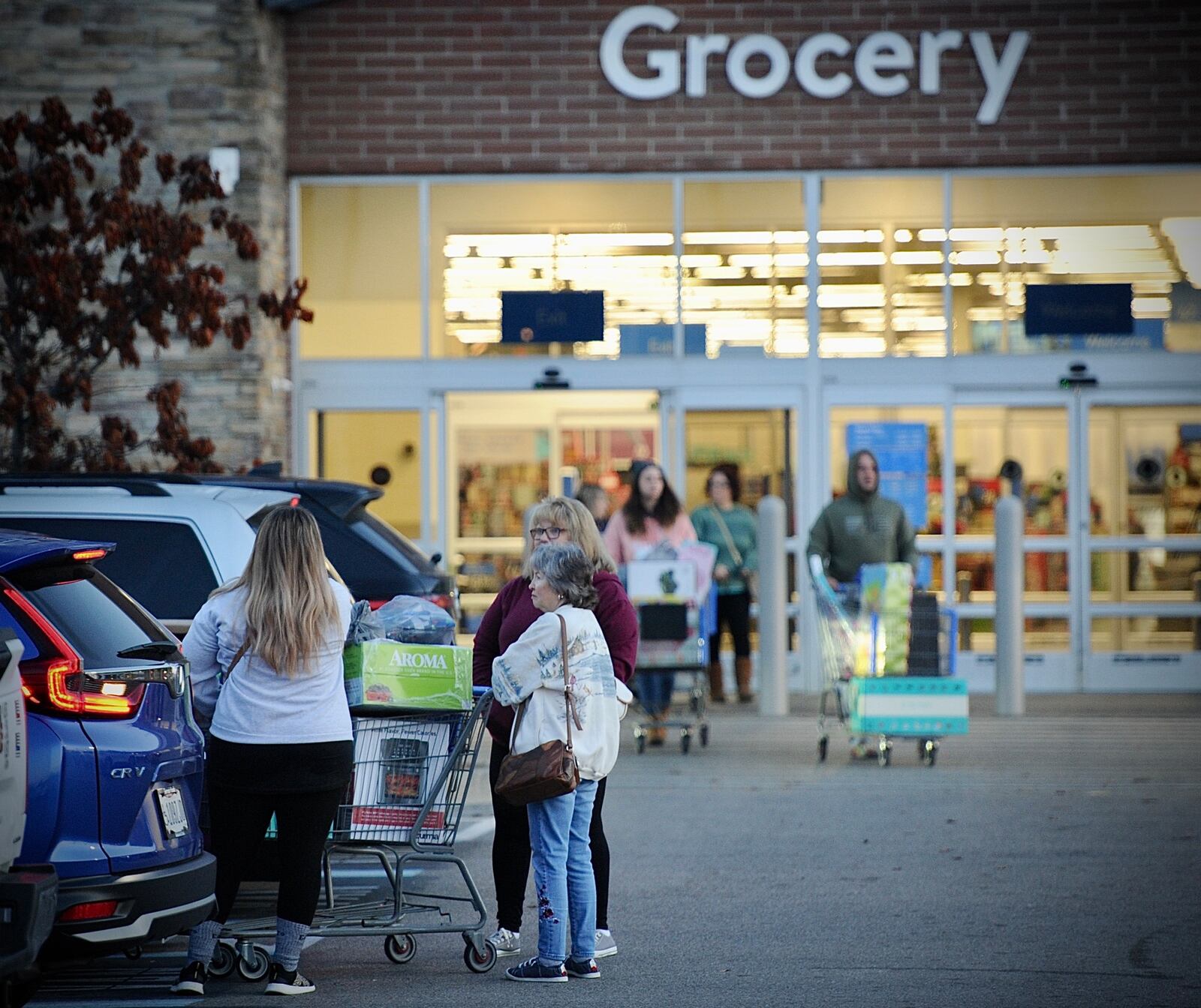 Five police cruisers sit outside the Beavercreek, Walmart on Black Friday, November 24, 2025 the store reopened after a shooting earlier in the week. MARSHALL GORBY \STAFF