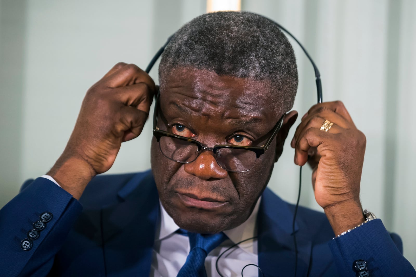 FILE - In this Sunday Dec. 9, 2018 file photo, Dr. Denis Mukwege from Congo prepares to listen to questions, with Nadia Murad from Iraq, at a media conference for the 2018 Nobel Laureates at the Nobel Institute in Oslo, Norway. Death threats against the Nobel Peace Prize-winning Congolese doctor have alarmed his supporters who are urging in Sept. 2020 the United Nations to reinstate protection by its peacekeepers, but it likely won't return. (Heiko Junge/NTB Scanpix via AP, File)