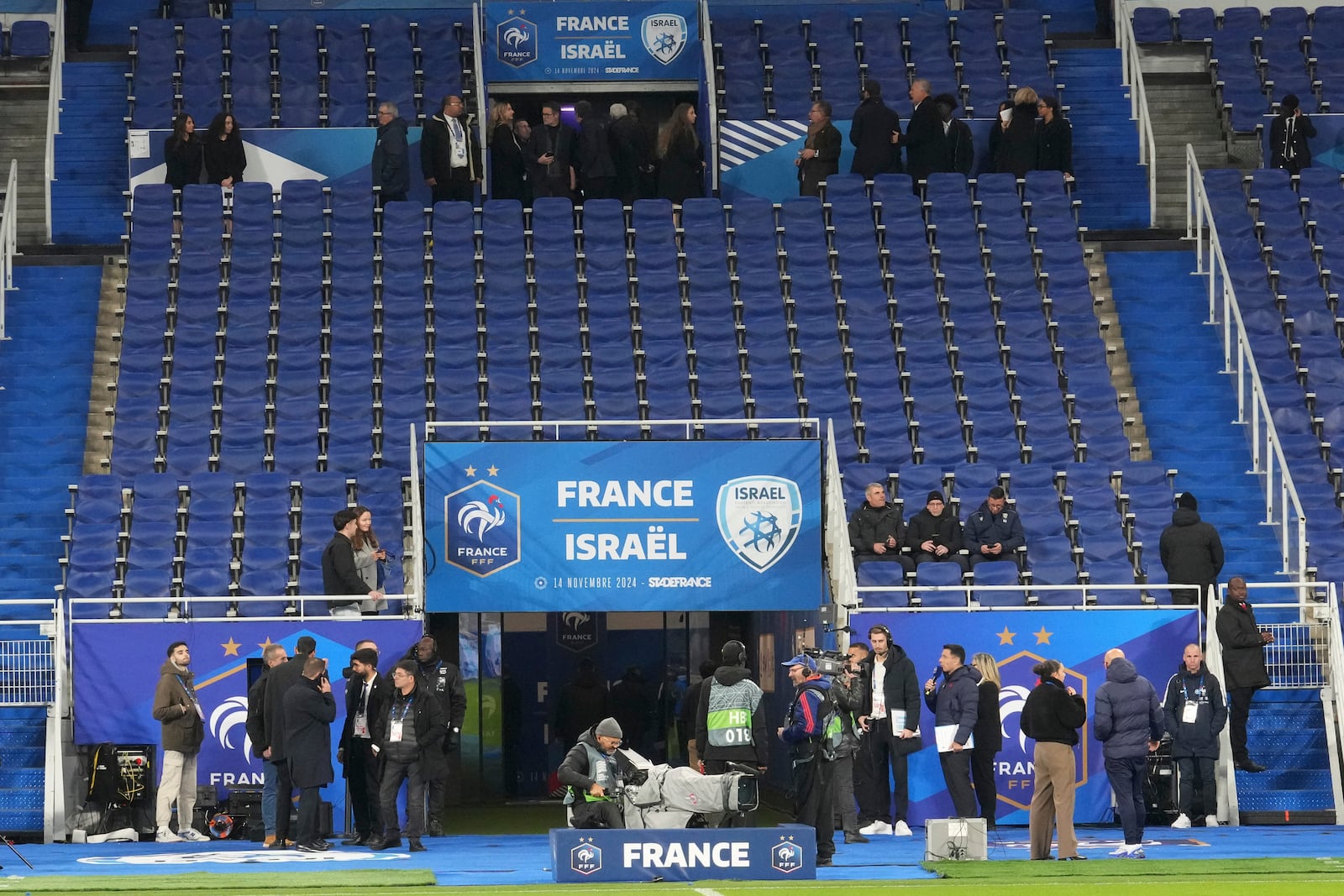 Spectators arrive before the UEFA Nations League soccer match between France and Israel at the Stade de France stadium in Saint-Denis, outside Paris, Thursday Nov. 14, 2024. (AP Photo/Michel Euler)