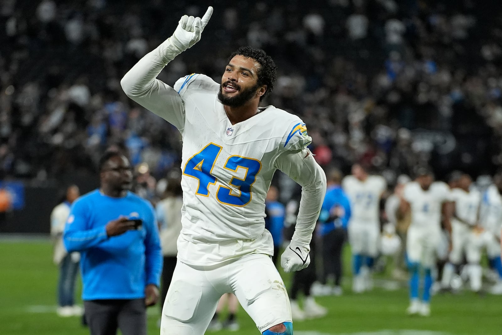 Los Angeles Chargers linebacker Troy Dye (43) celebrates after an NFL football game against the Las Vegas Raiders in Las Vegas, Sunday, Jan. 5, 2025. (AP Photo/John Locher)