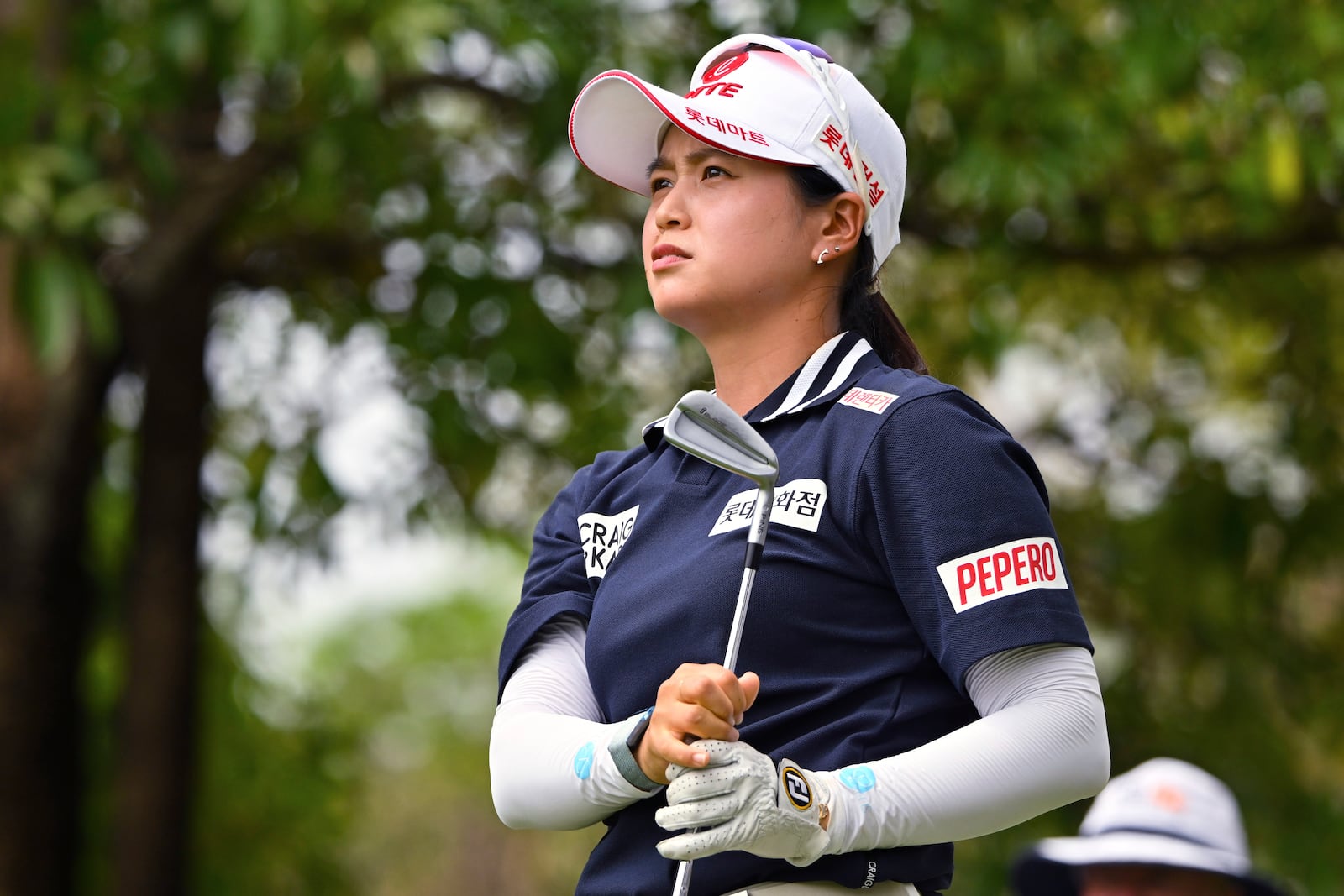 Hye-Jin Choi of South Korea watches her shot on the 16th hole during the first round of the LPGA Honda Thailand golf tournament in Pattaya, southern Thailand, Thursday, Feb. 20, 2025. (AP Photo/Kittinun Rodsupan)