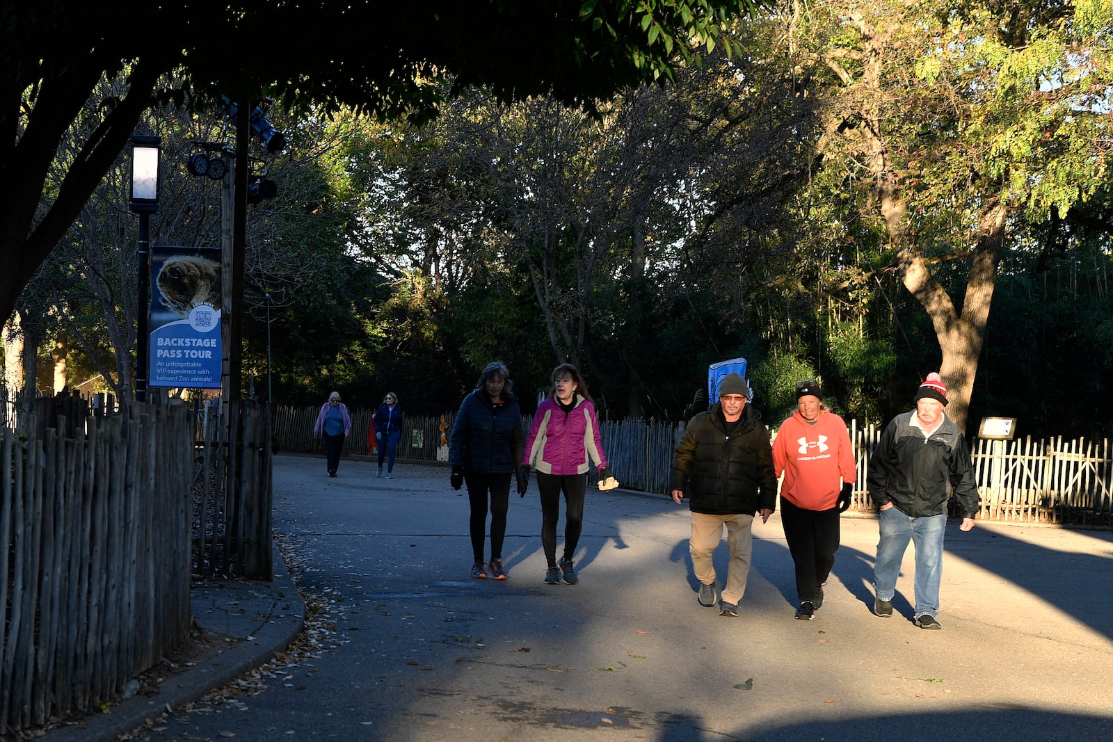 Members of the Get Healthy Walking Club walk the paths past the animal enclosures during the morning at the Louisville Zoo in Louisville, Ky., Friday, Oct. 18, 2024. (AP Photo/Timothy D. Easley)