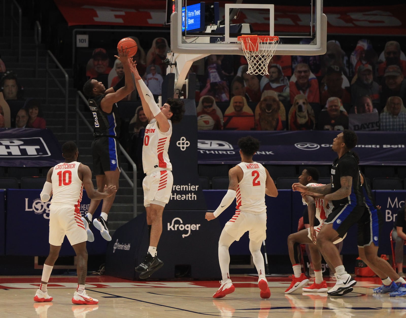 Dayton's Mustapha Amzil defends a shot by Javonte Perkins, of Saint Louis, on Friday, Feb. 19, 2021, at UD Arena. David Jablonski/Staff