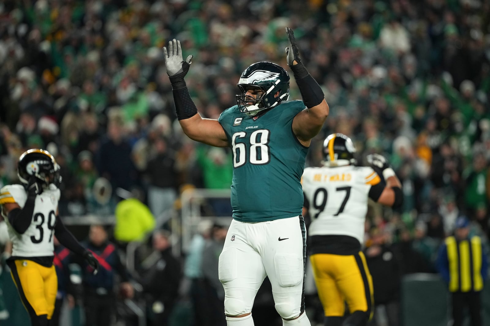 Philadelphia Eagles offensive tackle Jordan Mailata (68) reacts after a touchdown by Eagles wide receiver A.J. Brown during the first half of an NFL football game against the Pittsburgh Steelers on Sunday, Dec. 15, 2024, in Philadelphia. (AP Photo/Matt Slocum)