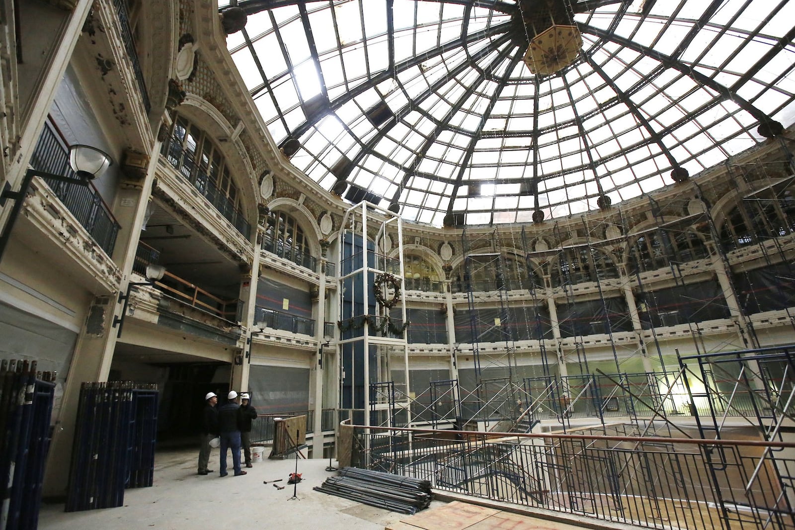 Scaffolding is being installed to complete lead paint removal inside the Dayton Arcade rotunda area. The escalator has been removed and is elevator is to be removed soon according to developers. TY GREENLEES / STAFF