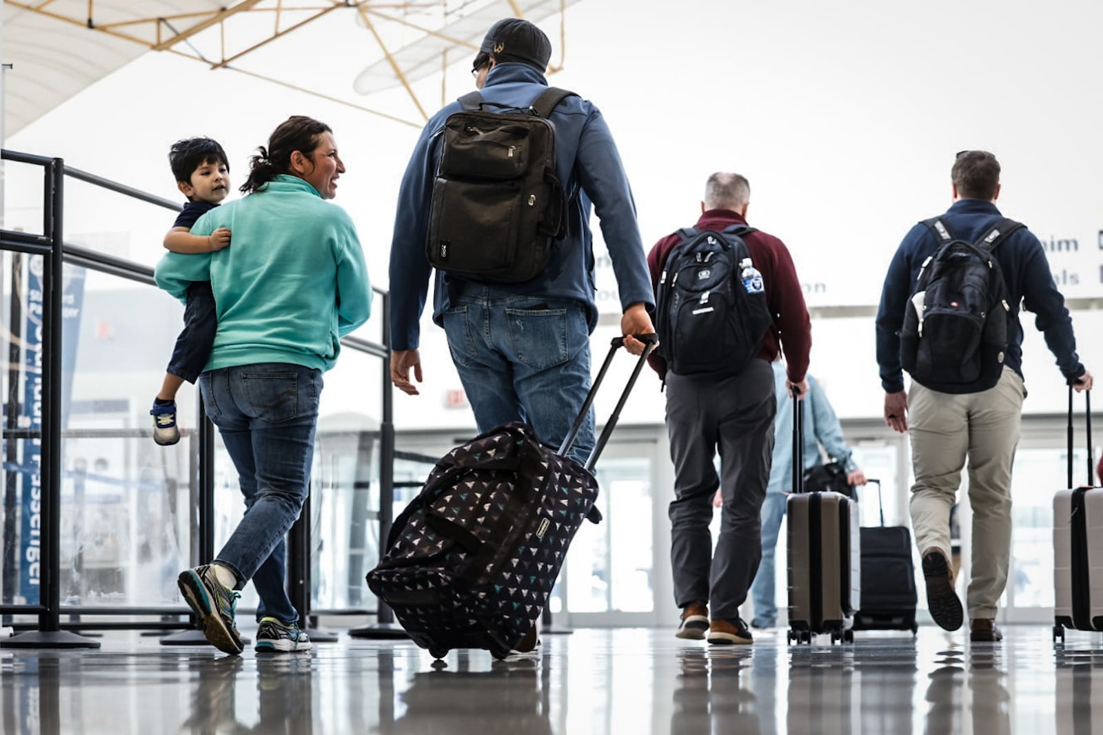 Holiday travelers move through the Dayton International Airport on Tuesday, Dec. 12, 2023. AAA projects 4.7 million Ohioans and more than 389,000 Dayton area residents will travel over the 10-day year-end holiday travel period of Dec. 23, 2023 to Jan. 1, 2024.  JIM NOELKER/STAFF