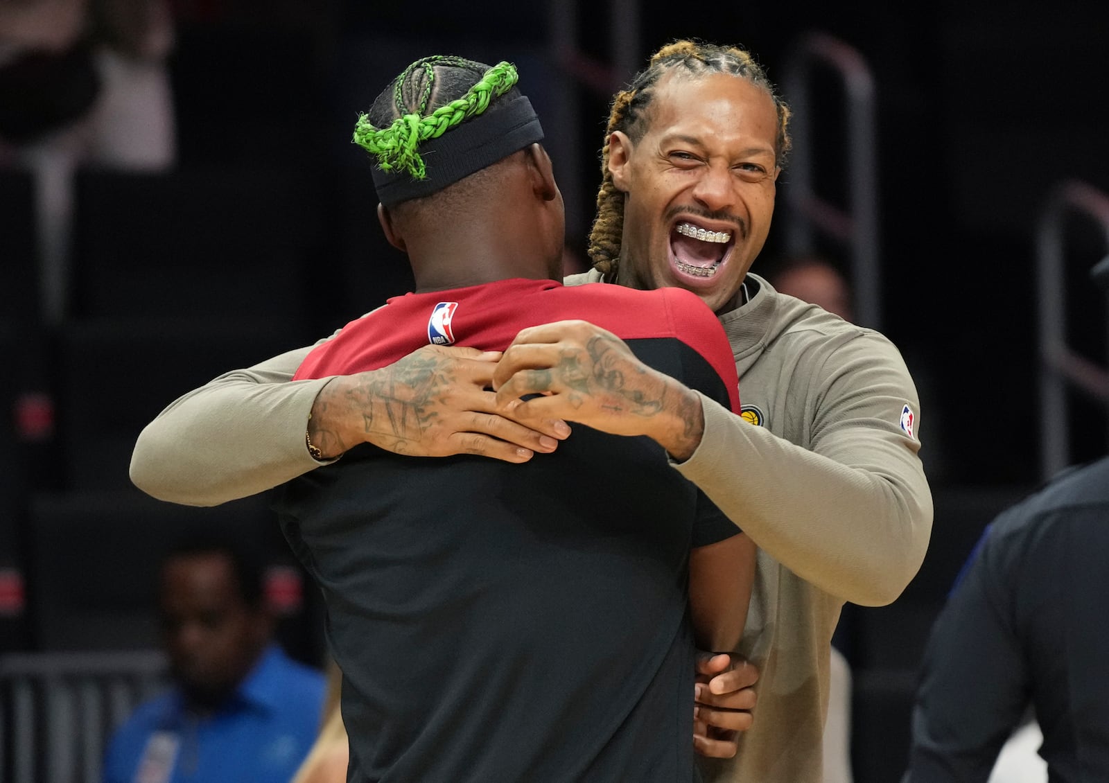 Indiana Pacers forward James Johnson, right, talks with Miami Heat forward Jimmy Butler before an NBA basketball game Thursday, Jan. 2, 2025, in Miami. (AP Photo/Lynne Sladky)